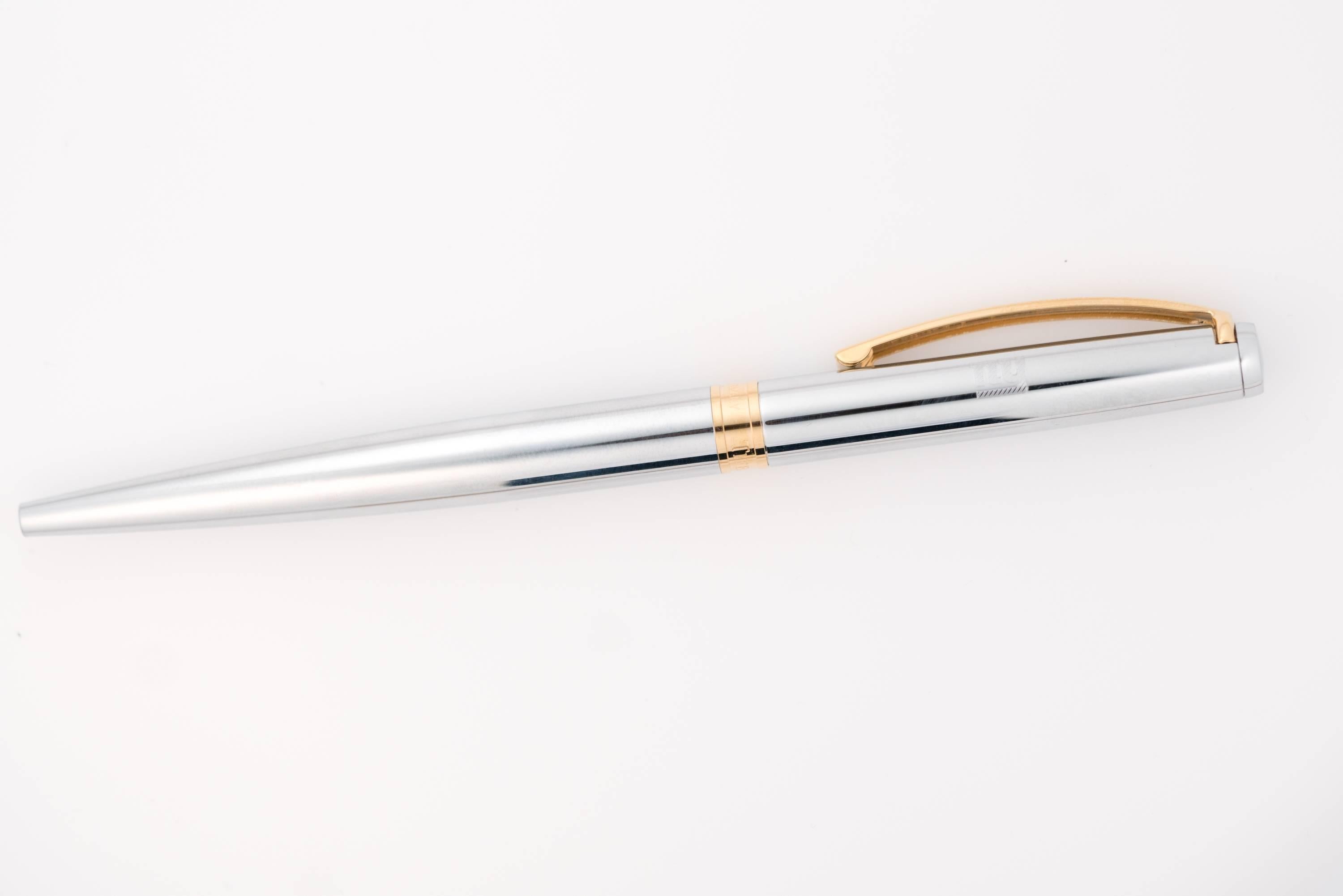 Commissioned by the New York Giants, this elegant silver tone ballpoint pen was made in Germany by Tiffany and Co. 
It features the NY Giants logo engraved on the upper half of the pen with the Tiffany and Co. logo engraved on the gold tone center