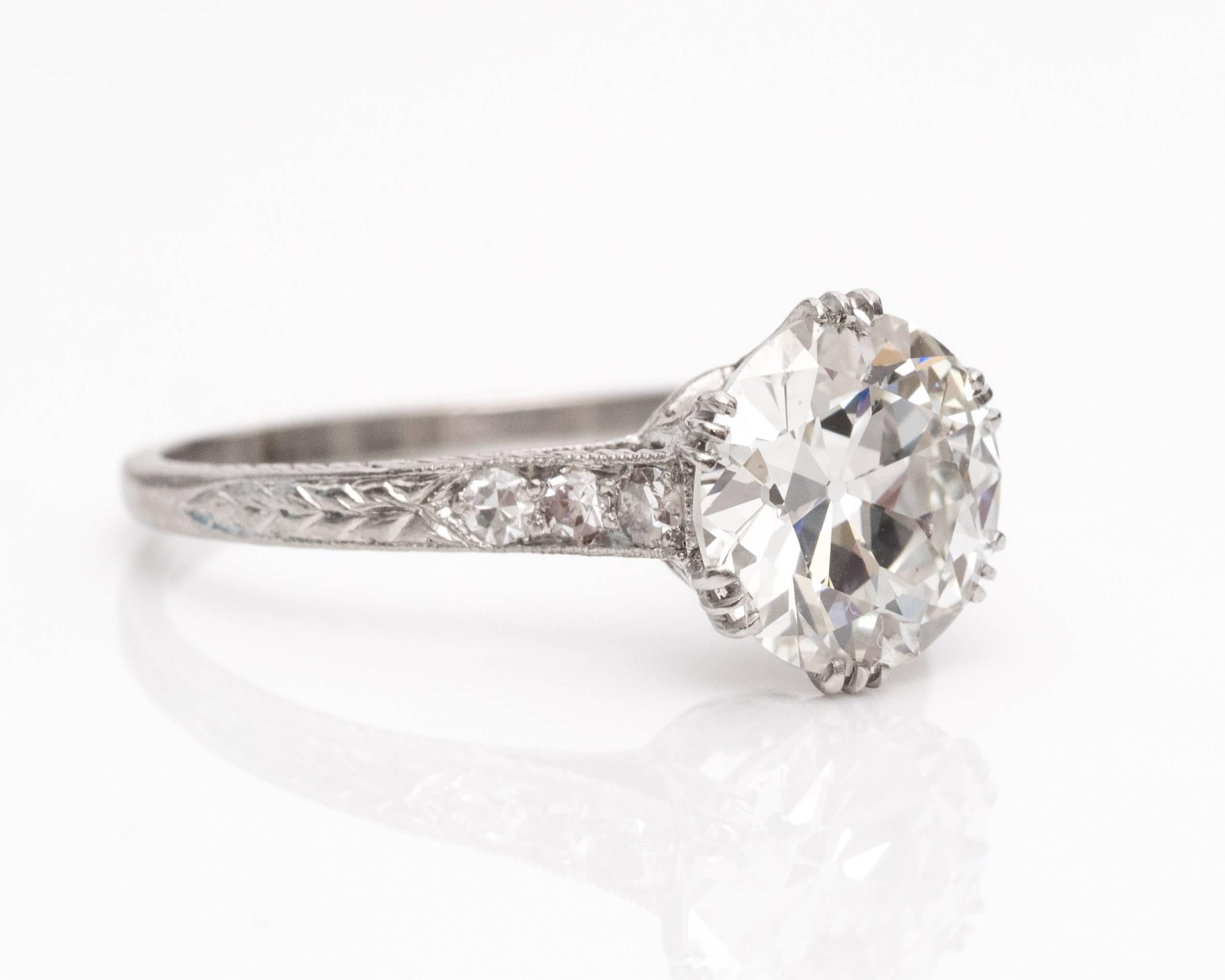 GIA Certified 2.01 Carat Diamond Platinum Engagement Ring. This 1920s diamond and platinum handcrafted ring embodies Art Nouveau and Edwardian motifs. The GIA certified center stone is an Old European shape weighing a hefty 2.01 carats. The diamond