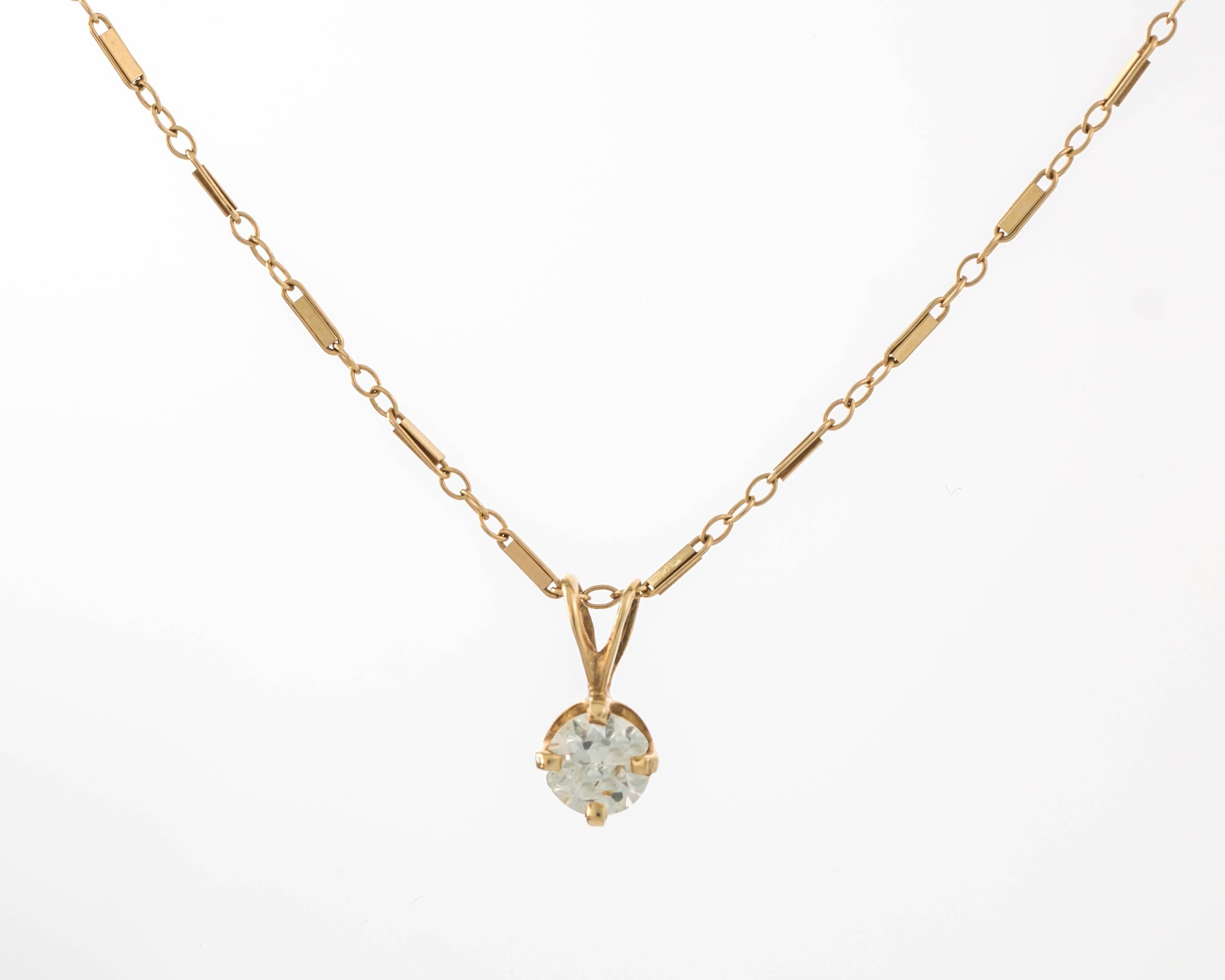 This 1930s Art Deco .75 Carat Old European Diamond Solitaire Necklace features a 14 karat yellow gold 4 prong setting and delicate chain which have developed a slight rose tone patina over the decades. This beautiful necklace features a unique