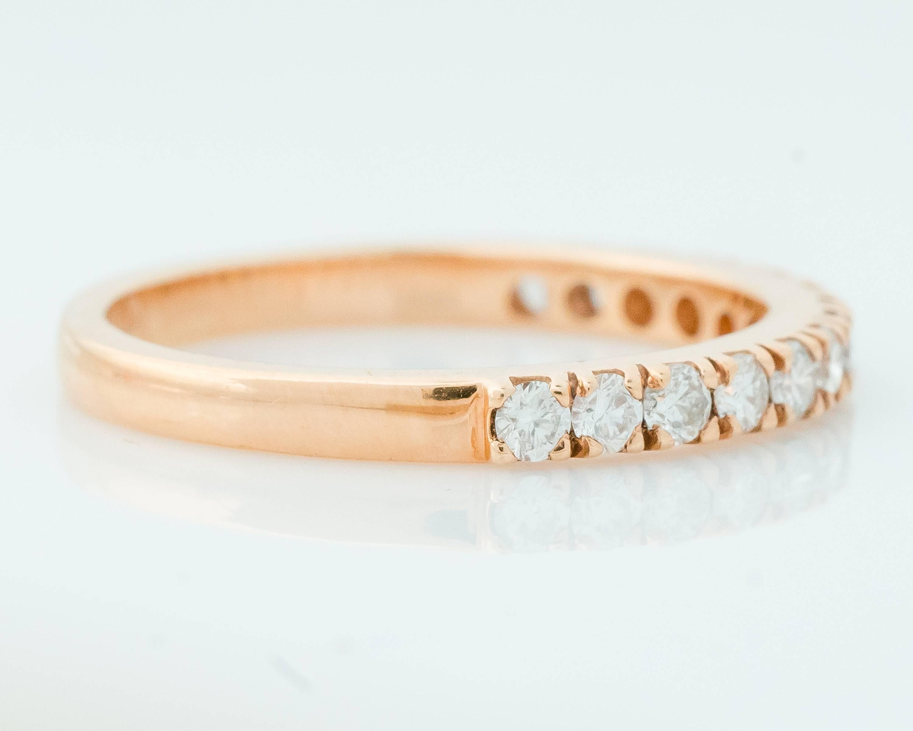 Stackable, modern, versatile, beautiful! This sweet and elegant 18 Karat Rose Gold and Diamond Eternity band can be worn alone, with other rings and stacked! The pink hue of the Rose Gold makes each diamond sparkle and shine individually and unites