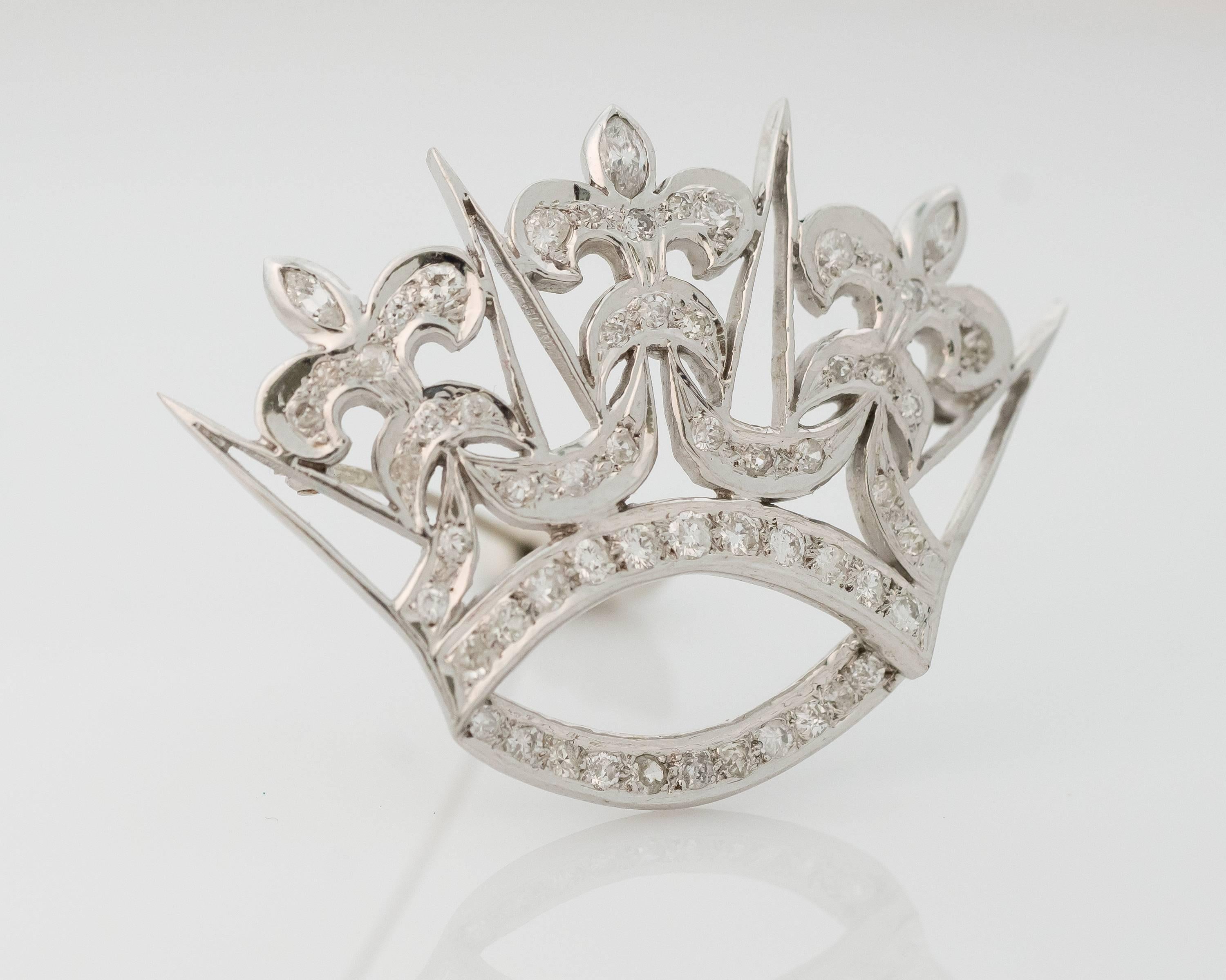 This 1930s Art Deco Diamond Crown Convertible Brooch features 1.00 total carats of single cut and marquise diamonds set in 14 karat white gold. The crown measures 1.75 inches wide by 1.25 inches long and has a fixed bail on the back to receive your
