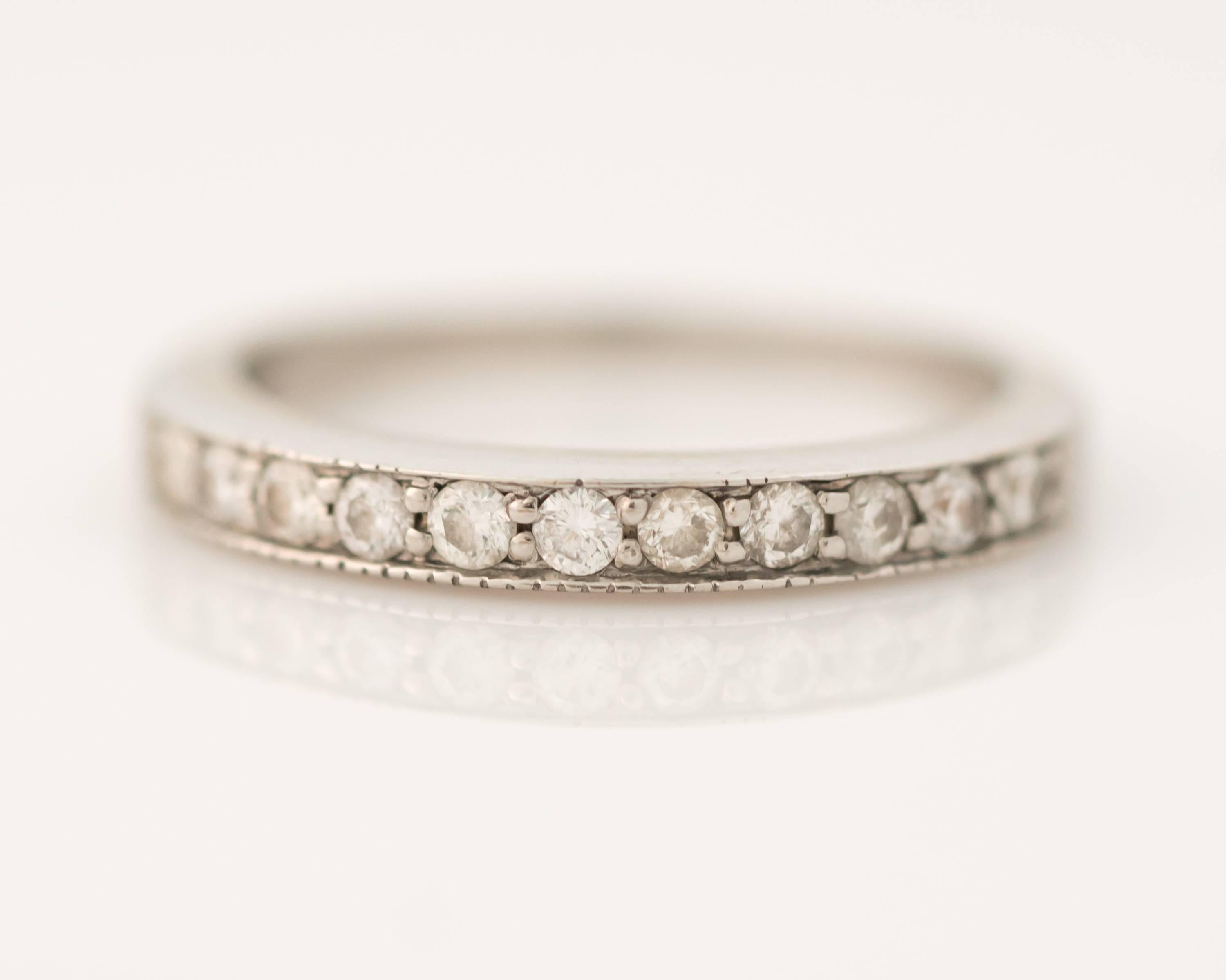 This Diamond and 14 karat white gold halfway around Eternity Band ring looks great with everything! The shank of this lovely ring features .25 carats of prong set round brilliant diamonds along the front half of the ring. The smooth back half of the