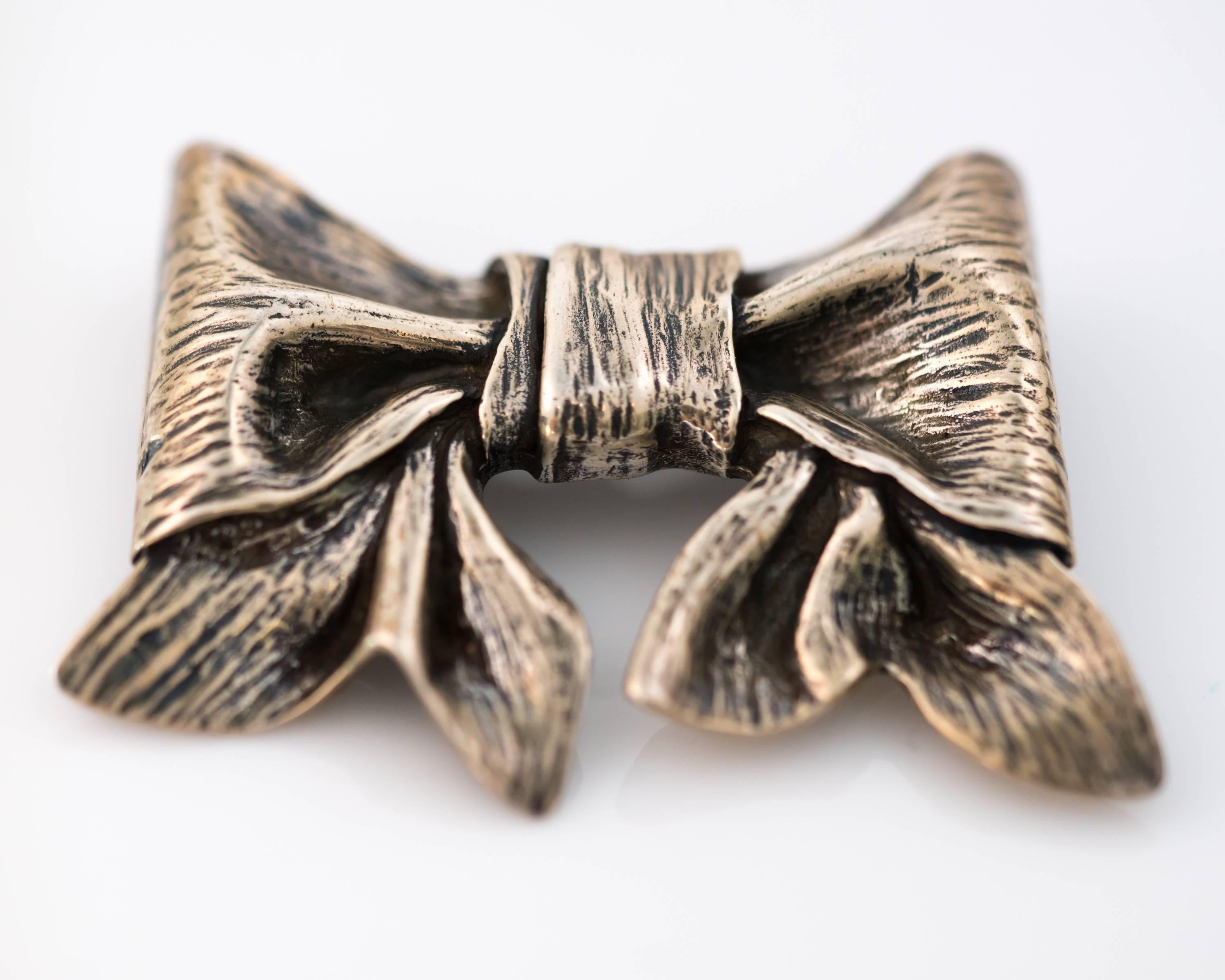 This James Avery Sterling Silver Ribbon Bow Brooch is a highly collectible, everyday Classic accessory! This retired design comes from Texas based family owned and operated jeweler, James Avery, known for creating finely crafted, timeless pieces