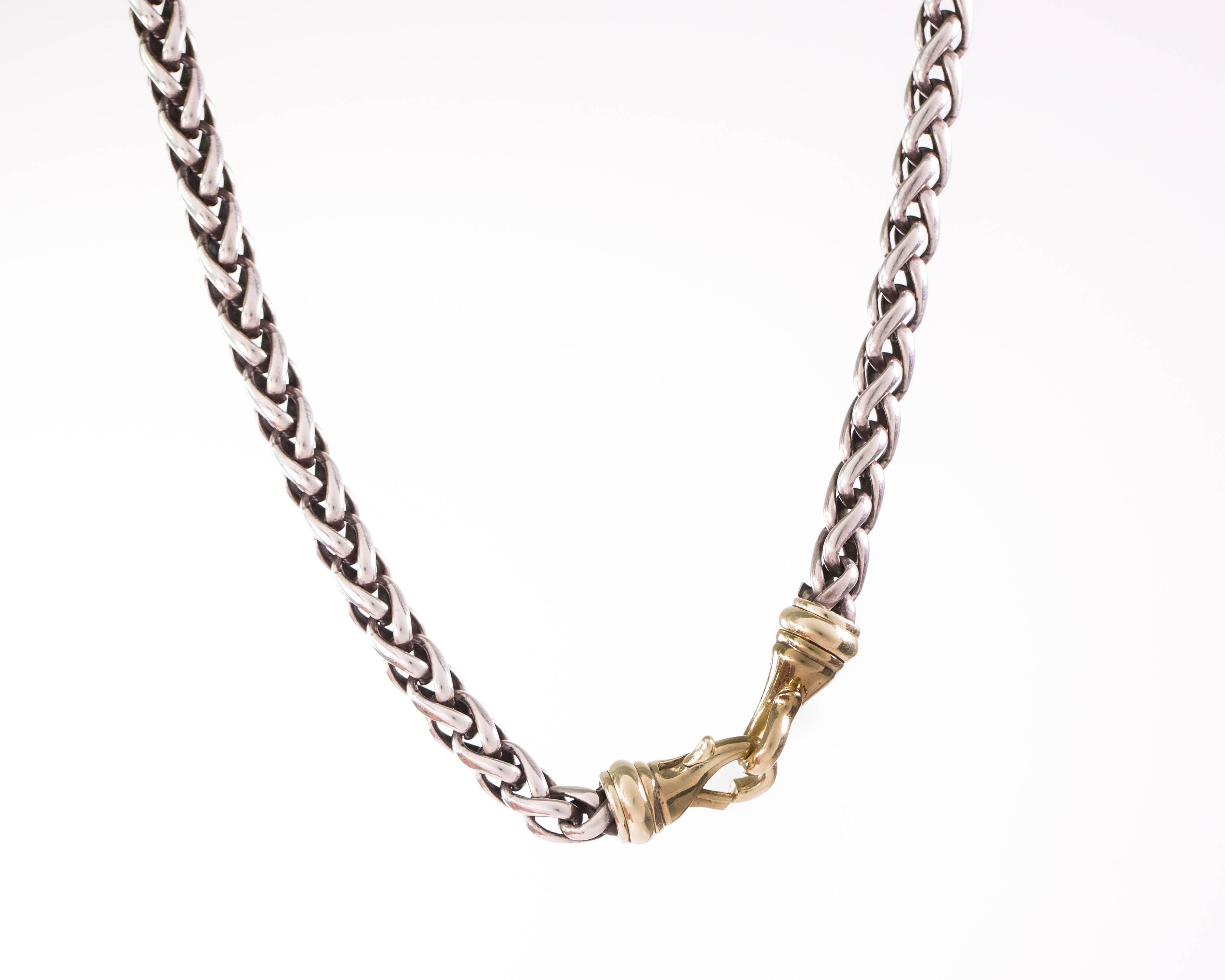 Gorgeous and Classic! You'll want to wear this David Yurman Sterling Silver and 18 Karat Yellow Gold Wheat Chain everywhere! The 6 millimeter thick sterling silver wheat chain is capped one either end with a 18 karat yellow gold lobster claw clasp