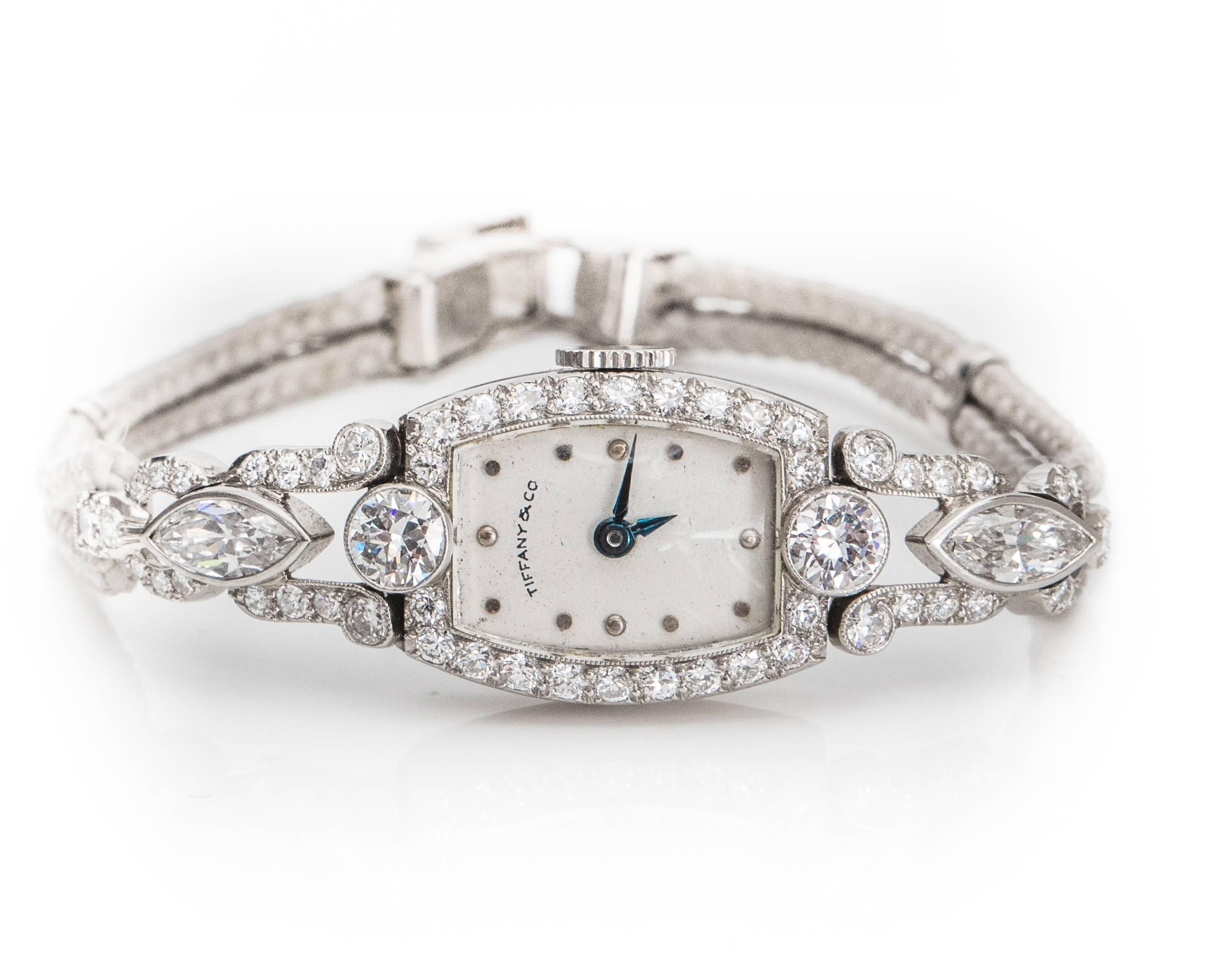 This stunning 1905 Antique Tiffany and Co Diamond and Platinum watch exemplifies Luxury at it's Finest! 
This elegant Edwardian timepiece features 3 carats of Old European and Marquise diamonds. 
Old European prong set diamonds adorn the bezel, lugs