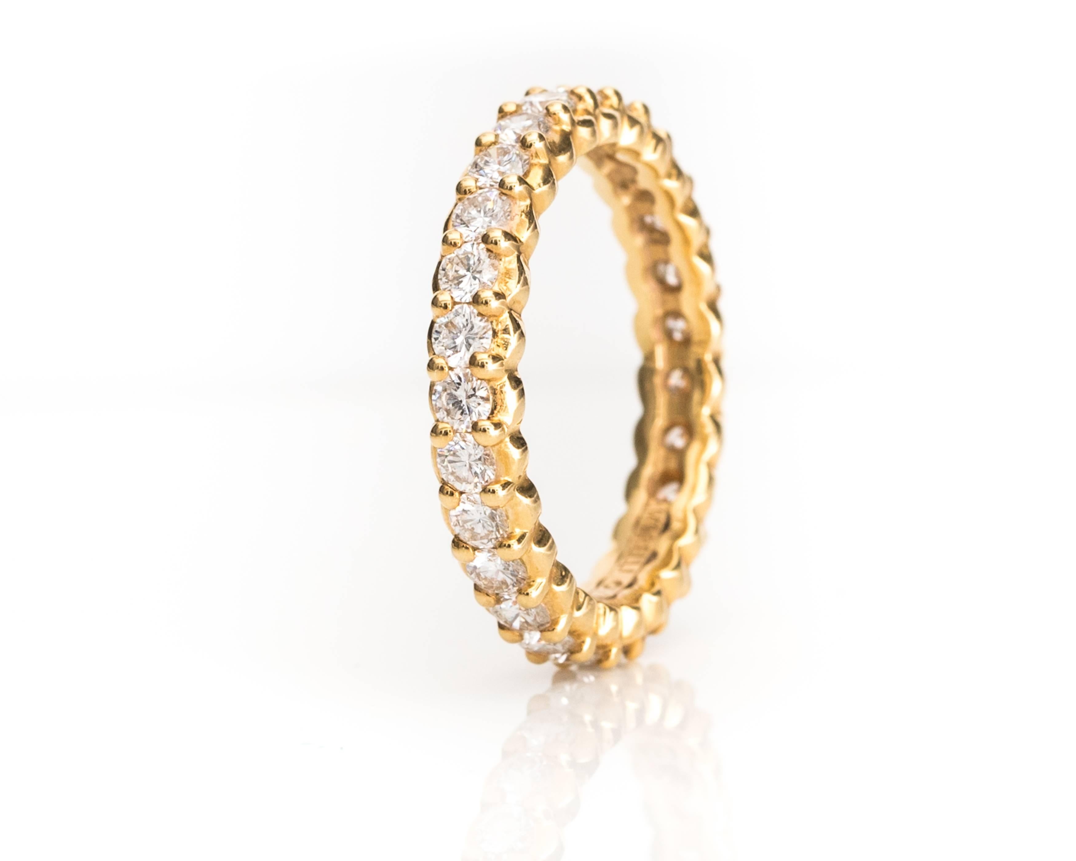 Gorgeous! This beautiful, handcrafted Paul Morelli 18 Karat Yellow Gold and Diamond Eternity Band is perfect to wear as a wedding band, alone or stacked. This Pinpoint Eternity Band features 1.5 carats total weight of round brilliant diamonds in a