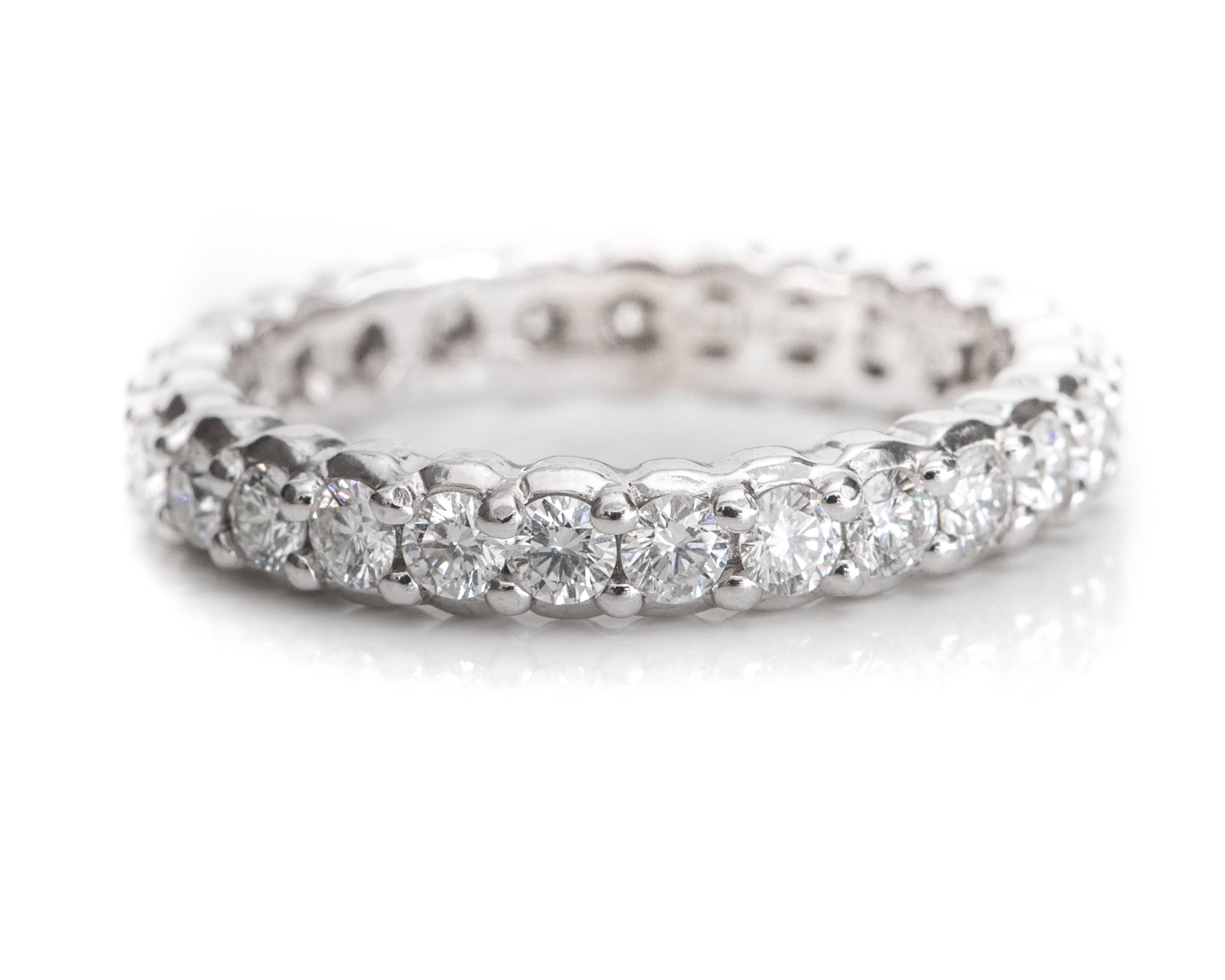 Gorgeous! This beautiful, handcrafted Paul Morelli 18 Karat White Gold and Diamond Eternity Band is perfect to wear as a wedding band, alone or stacked. This Pinpoint Eternity Band features 1.5 carats total weight of round brilliant diamonds in a 14