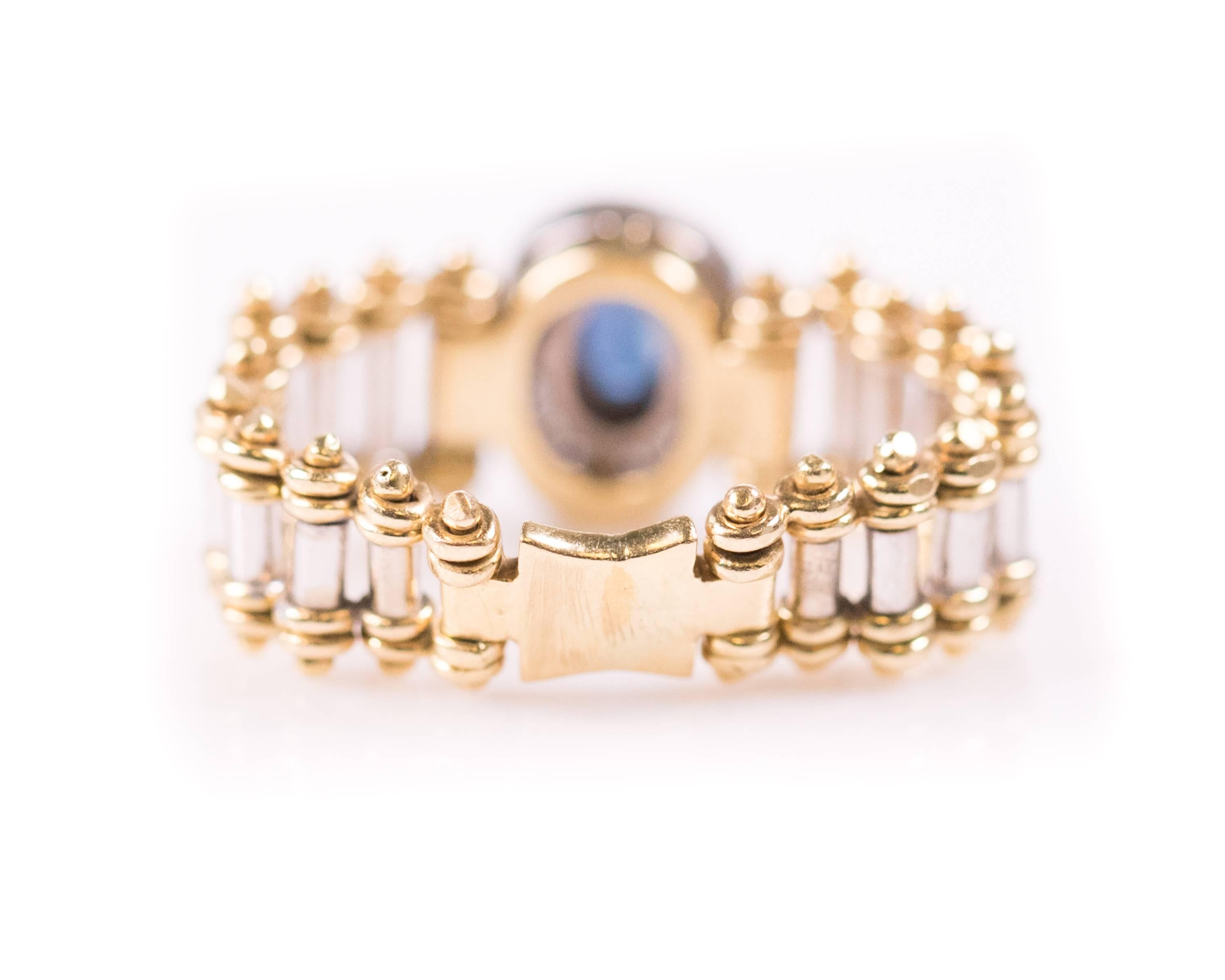 1980s Oval Sapphire and Diamond Halo 18 Karat Gold Flex Ring In Good Condition For Sale In Atlanta, GA