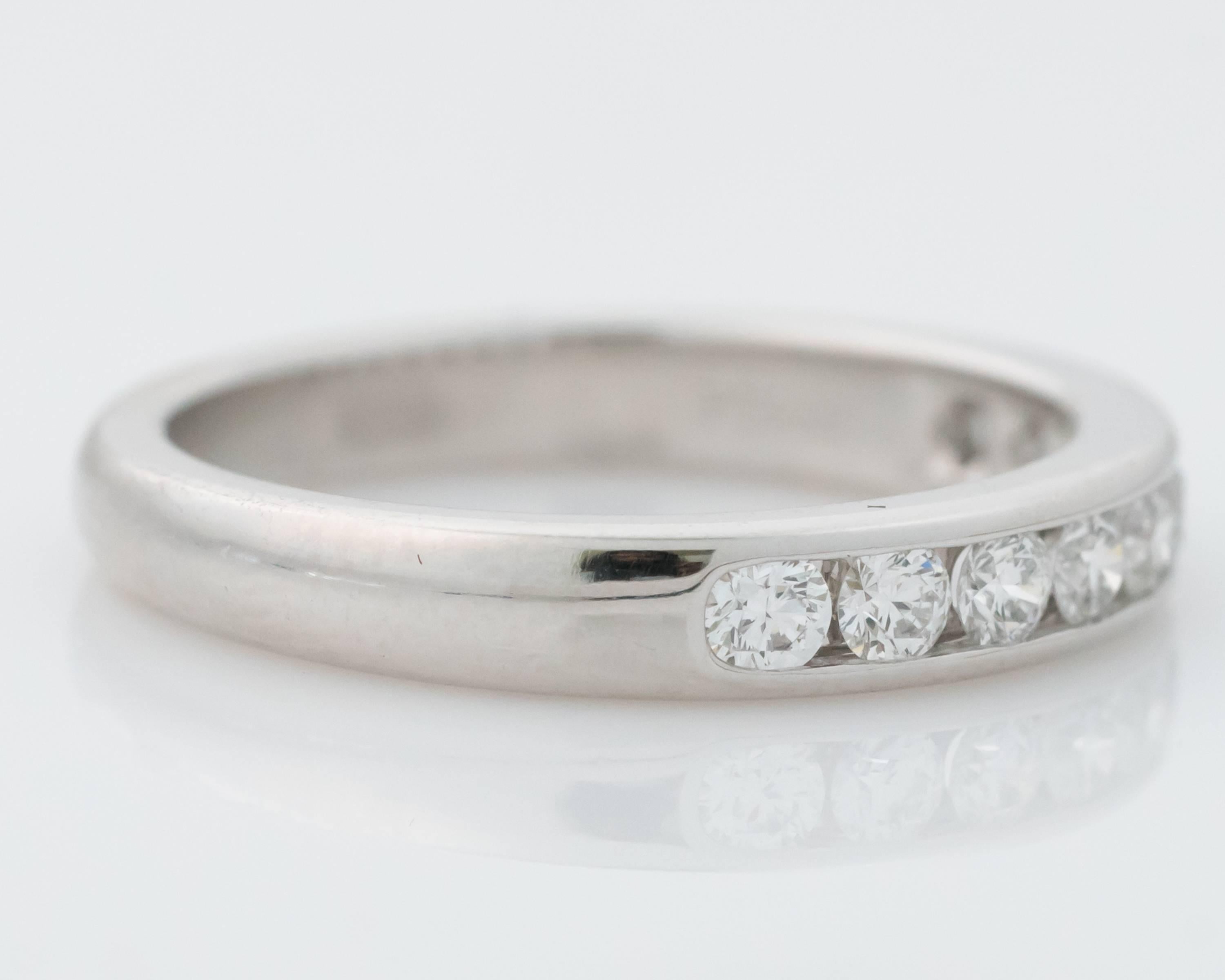 Beautiful, classic Tiffany & Co Halfway around Diamond Eternity band Ring Crafted in Platinum (hallmarked PT950) Also hallmarked Tiffany & Co Features 0.33 carats of diamonds, E color and VS1 clarity  All diamonds are Channel-set This ring is 3