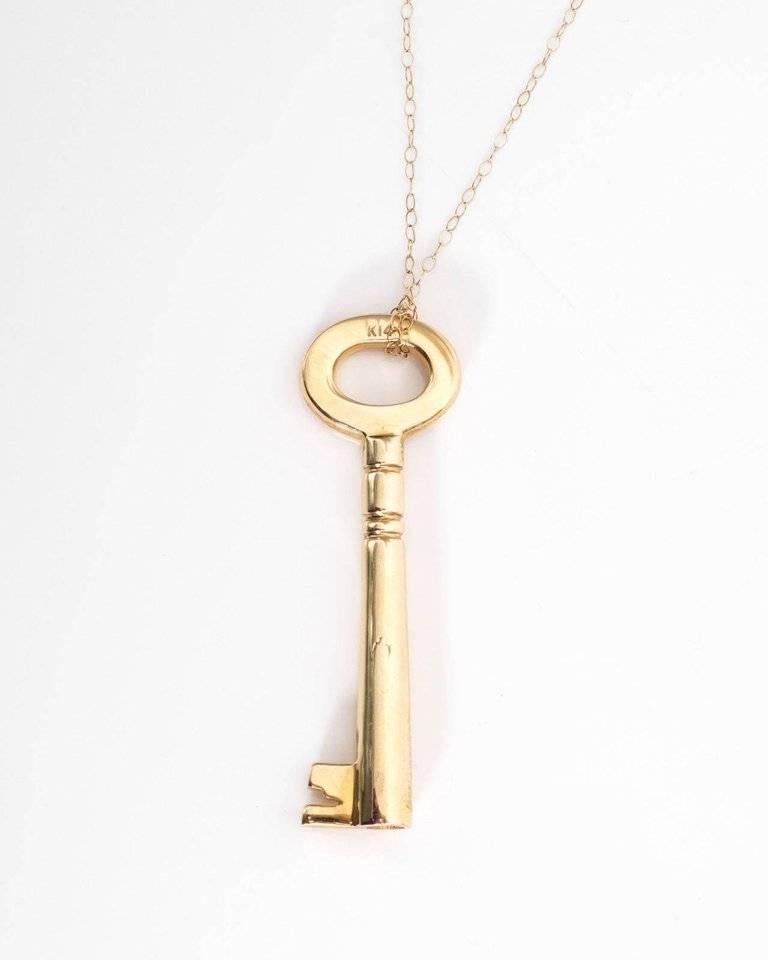 Diamond and 14 Karat Yellow Gold Key Pendant Necklace. 16 sparkling diamonds are set on the top of this key pendant. The remainder of the necklace is made of solid 14k yellow gold. The necklace comes with the 14k gold chain. 
Earn the key to her