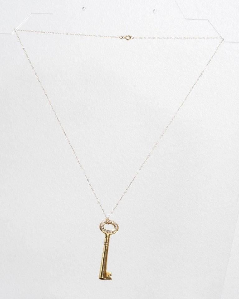 gold key necklace with diamonds
