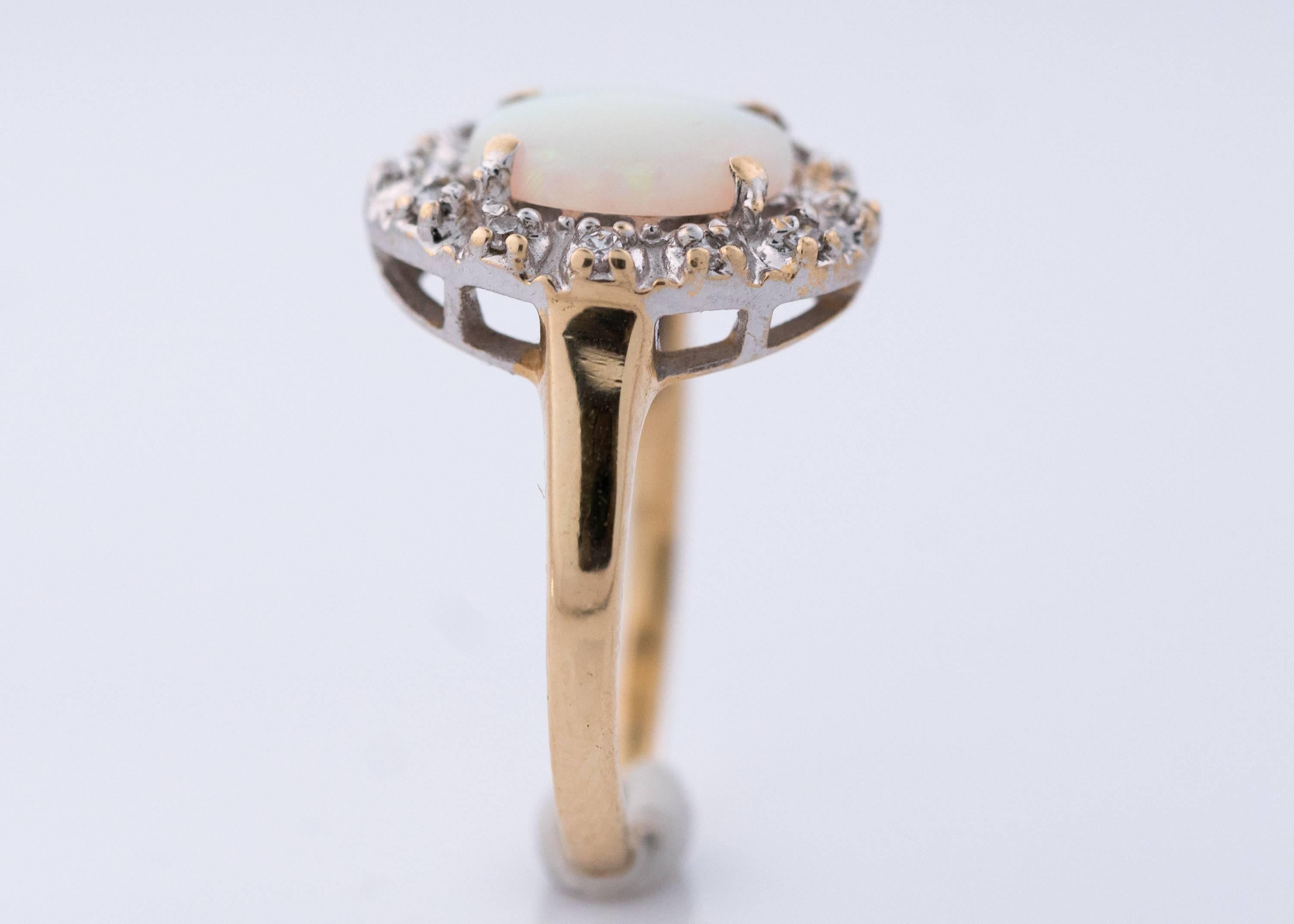 Women's 1960s Opal and Diamond Halo 14 Karat Yellow Gold Ring