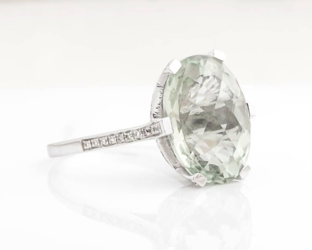 1960s Regal Prasiolite and Diamond Cathedral Cocktail Ring. Features a Prasiolite stone set in a six-prong frame with diamonds along the frame and into the shoulder. The diamonds continue around the basket of the head mount in a web design on the