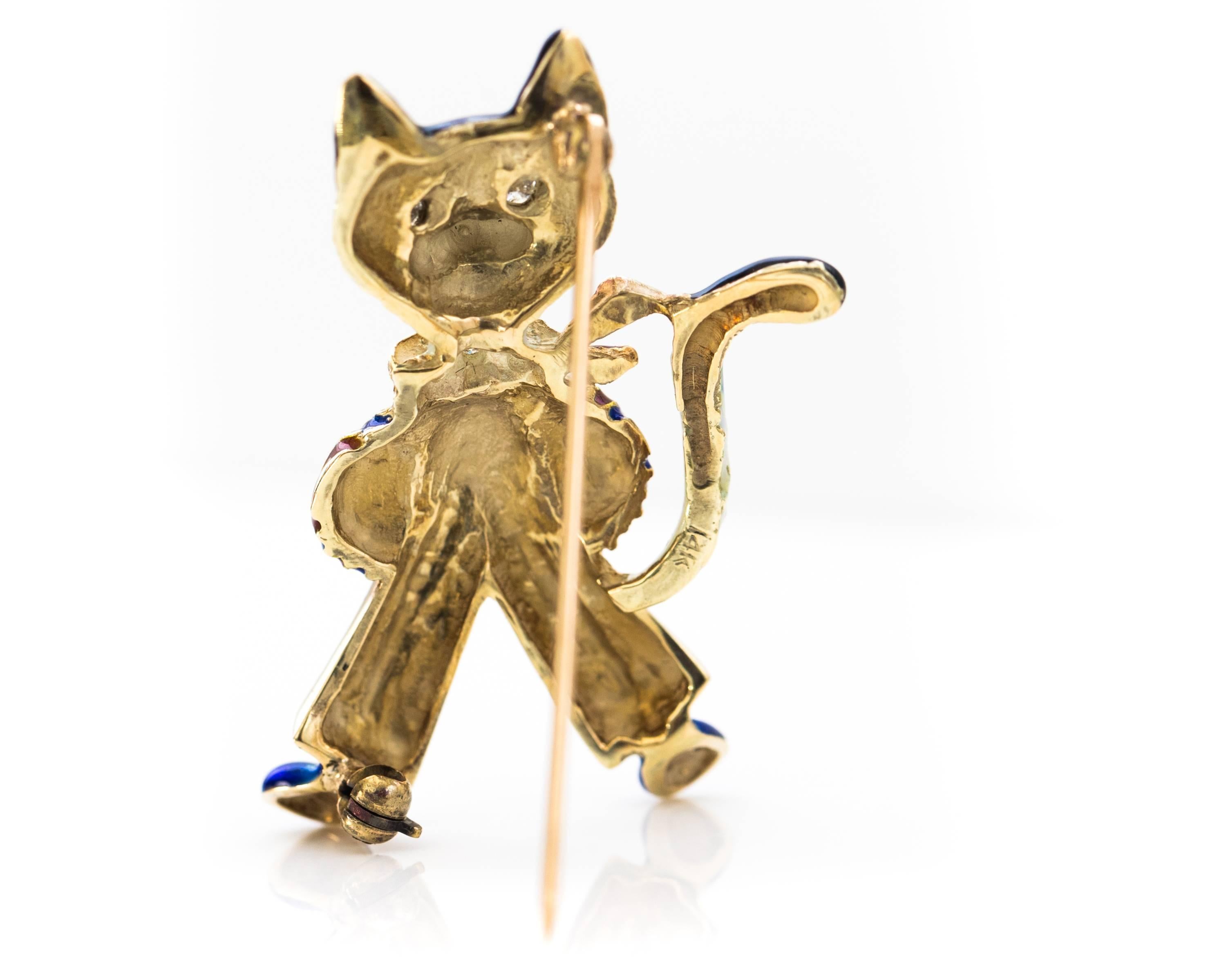 1950s Retro 14K Yellow Gold, Diamond and Enamel Fancy Cat Brooch.

This Hand Painted pin features Red, White and Blue Enamel with 5 Diamonds and 14K Yellow Gold.

Rich Blue fur frames the Happy Cat's white face and ears. The inner ears and sweet