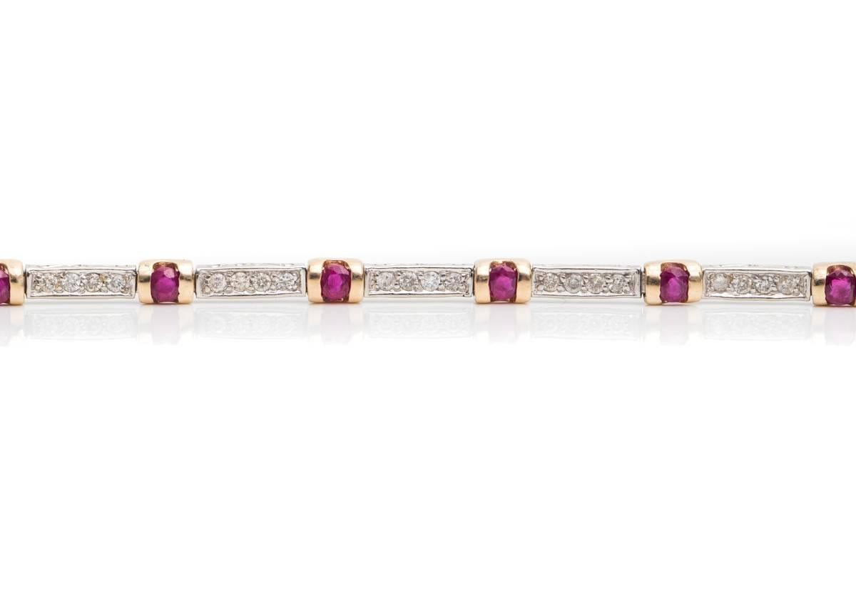1980s Diamond and Ruby, 14 Karat White and Yellow Gold Two Tone Link Bracelet

Features 48 Round Brilliant Diamonds and 12 Round Brilliant Rubies. These gorgeous gemstones are set in alternating links. Each of the 14 Karat White Gold links is set