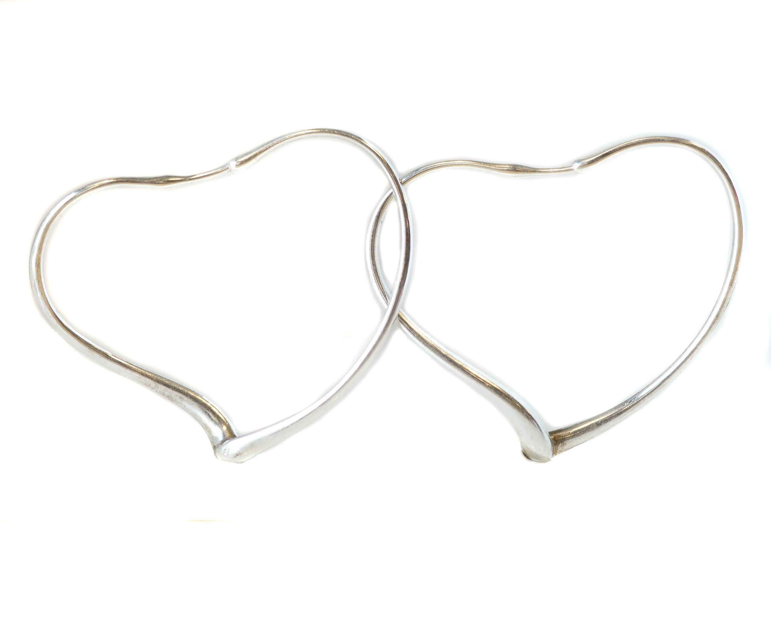 Elsa Peretti for Tiffany and Co. Open Heart Hoop Earrings - Sterling Silver

Features
High polish Sterling Silver
Fluid Heart Shape
5 centimeters wide x 4 centimeters high
Designed by Elsa Peretti for Tiffany and Co.

Earring Details:
Metal: