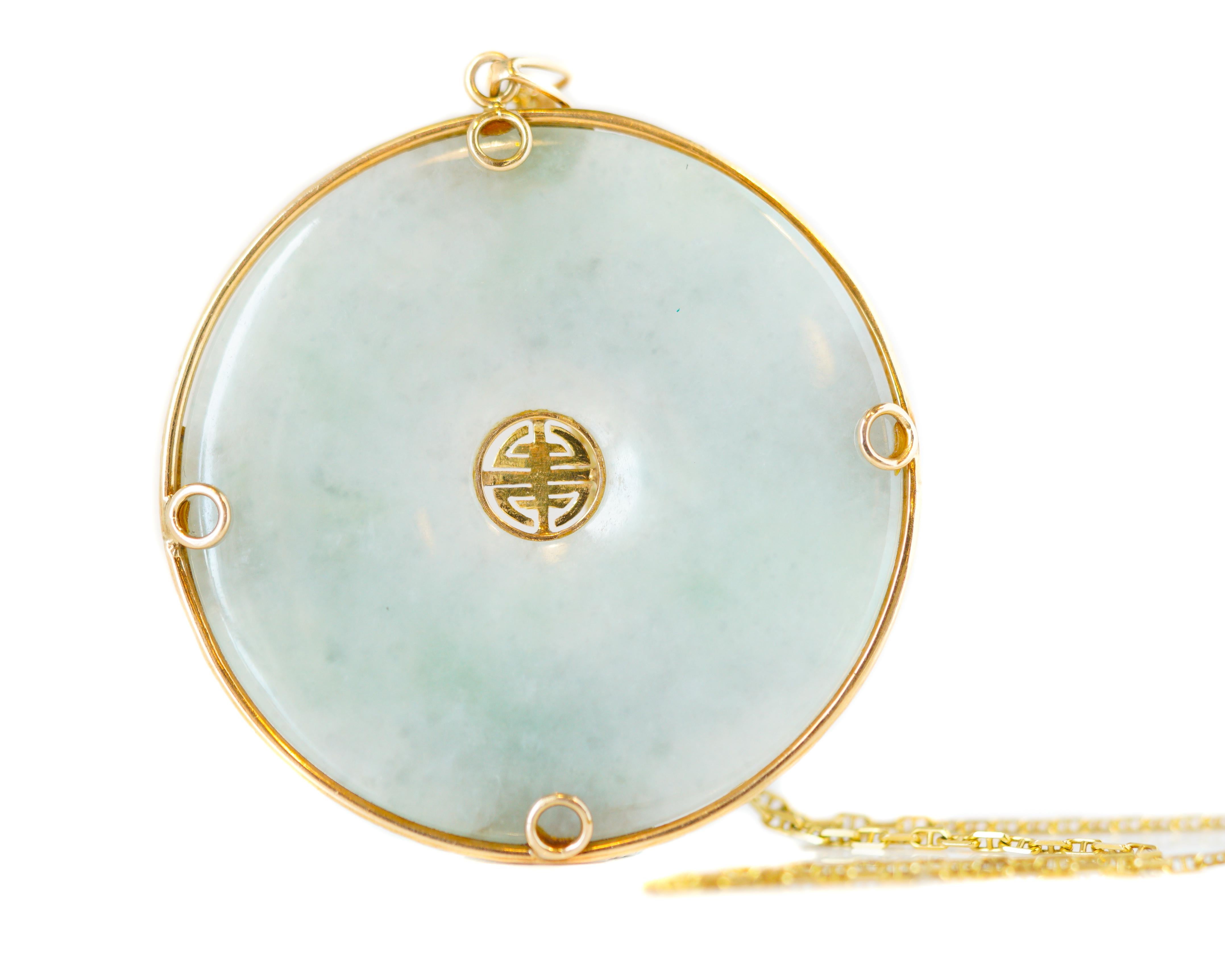 1950s Retro Good Luck Jade Necklace - 14 Karat Yellow Gold, Jade

Features:
2.25 inch wide Jade Disc Pendant 
14 Karat Yellow Gold Frame, Center and Border
Double Bail on pendant for added stability
18 inch long, 14 Karat Yellow Gold, Horse Bit