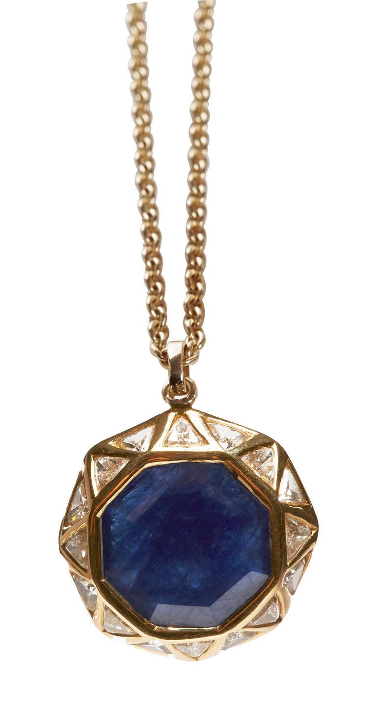 Sapphire and Trillion Diamond Octagon Pendant Hung on an 18 Inch Chain. 18k Gold.
Sapphire 6.46 ct
Diamond 0.56 ct