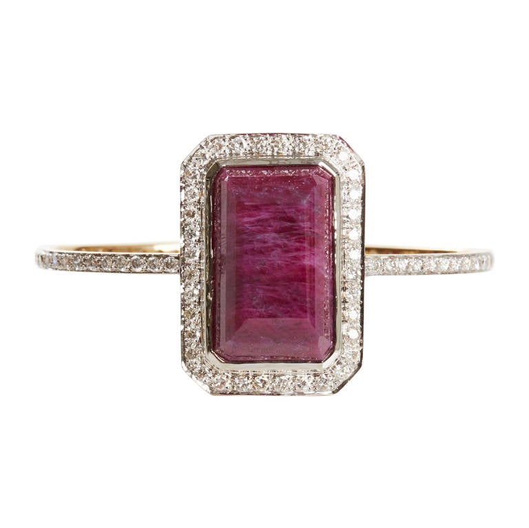 Hand Carved Ruby Set in 18k Yellow Gold, Surrounded by Diamond Pave.
Ruby 41.50 ct.
Diamond 3.16 ctw.