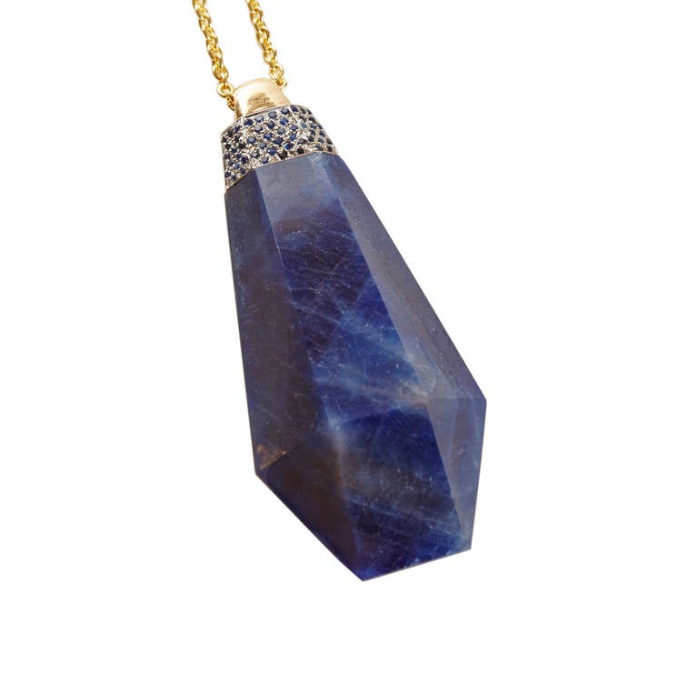 Hand Carved Blue Sapphire With Sapphire Pave Pendant, Capped With 18k Yellow Gold and Hung on An 18k Gold Chain. 
Sapphire 152 ct.