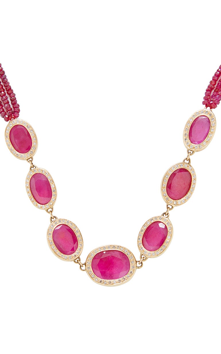 This necklace by Jade Jagger features oval rubies fashioned in a 18K gold setting and surrounded by encrusted white diamonds connecting to three rows of ruby beads.

Lobster closure
18K gold
Ruby, 48.6cts
Ruby beads, 49.36cts
White