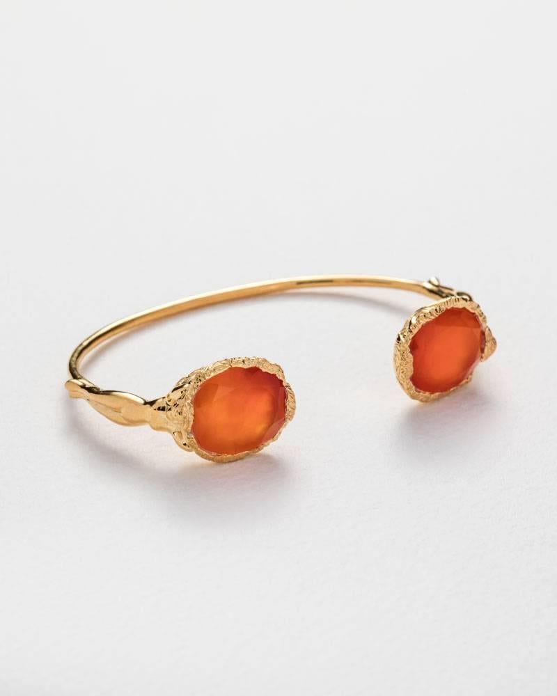 A gold vermeil handcuff featuring two carnelian stones.
From the Jade Jagger Maiden collection.
Handmade in Jaipur, India.