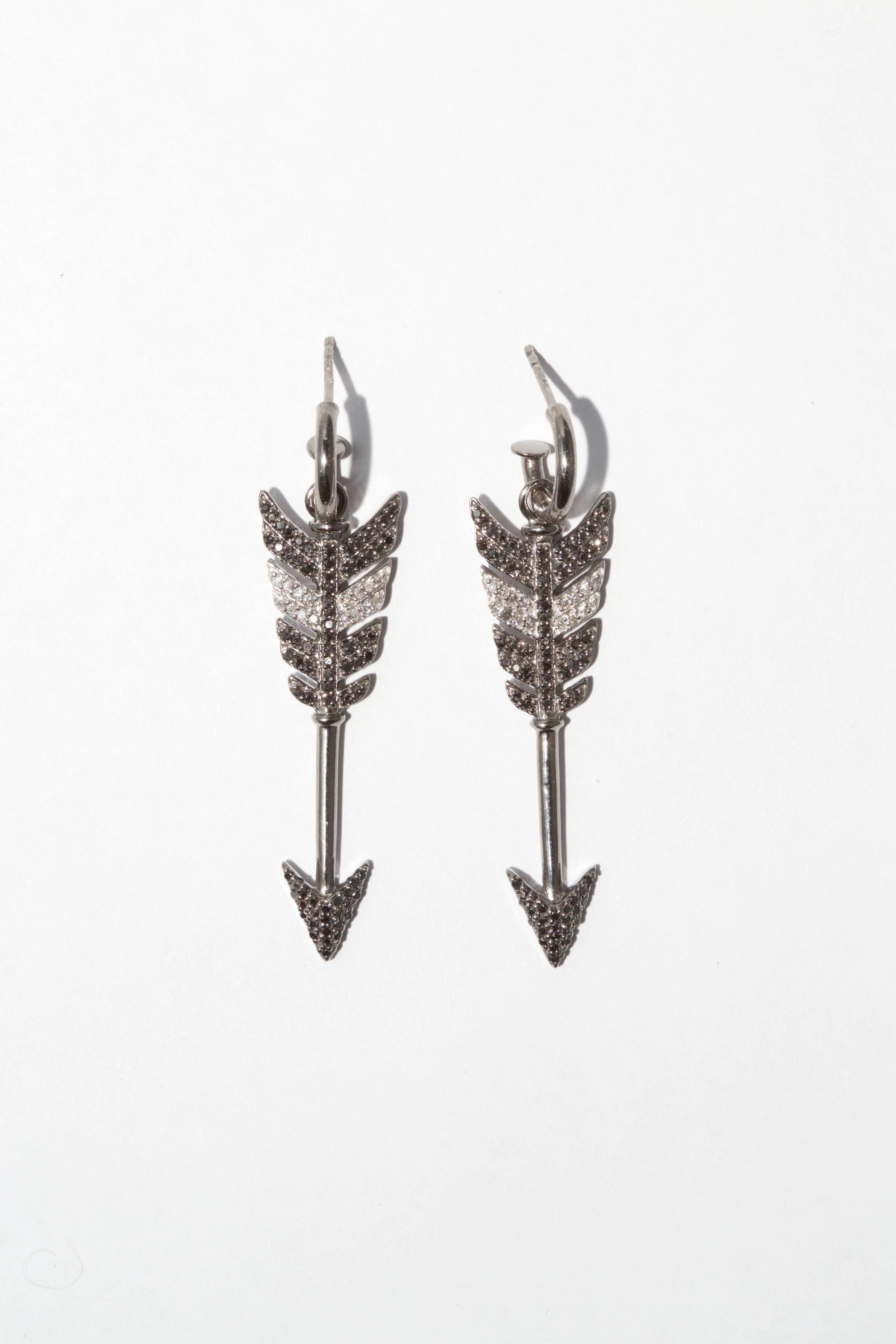 Large Black Diamond Arrow Earrings. Black and white diamonds, sterling silver with black rhodium plate.
Jade Jagger’s new Arrow collection, with a design lineage that follows on from the the best-selling “Wing” Collection she created for Garrard,
