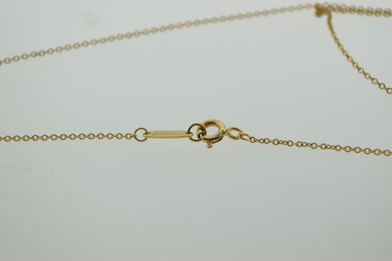 Tiffany & Co. L.O.V.E. Letters Diamond Gold Necklace In Excellent Condition For Sale In Miami, FL
