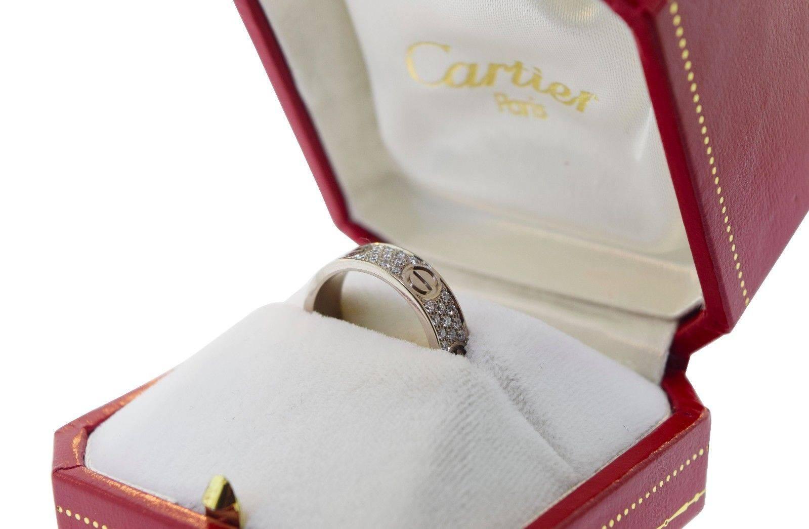 Cartier Diamond Paved LOVE Ring

A child of the 1970s New York, the LOVE collection remains today an iconic symbol of love that transgresses convention. The screw motifs, ideal oval shape and undeniable elegance establish the piece as a timeless