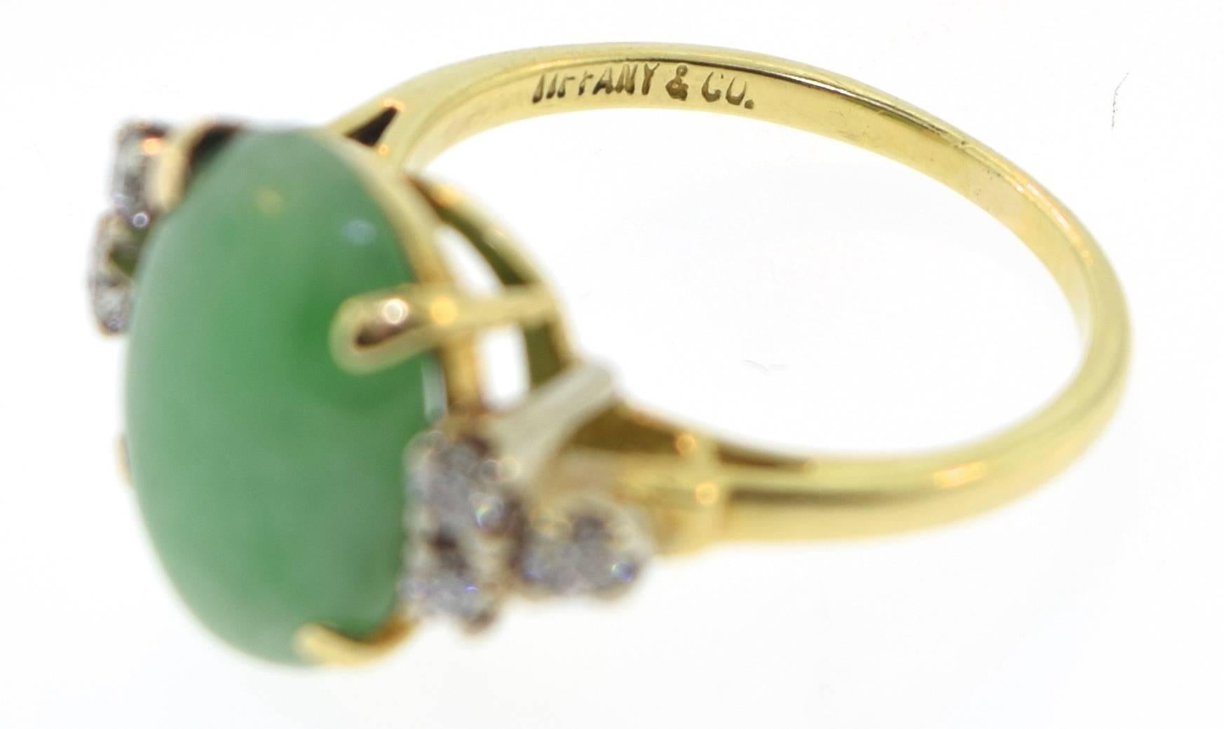 Beautiful Tiffany & Co. jade ring with diamonds. 
Metal: 18k Yellow Gold
Stones: Jade and Diamonds
Weight: 5.1g
Ring Size: 6.25 - 6.50
Hallmark: Tiffany & Co., 18K