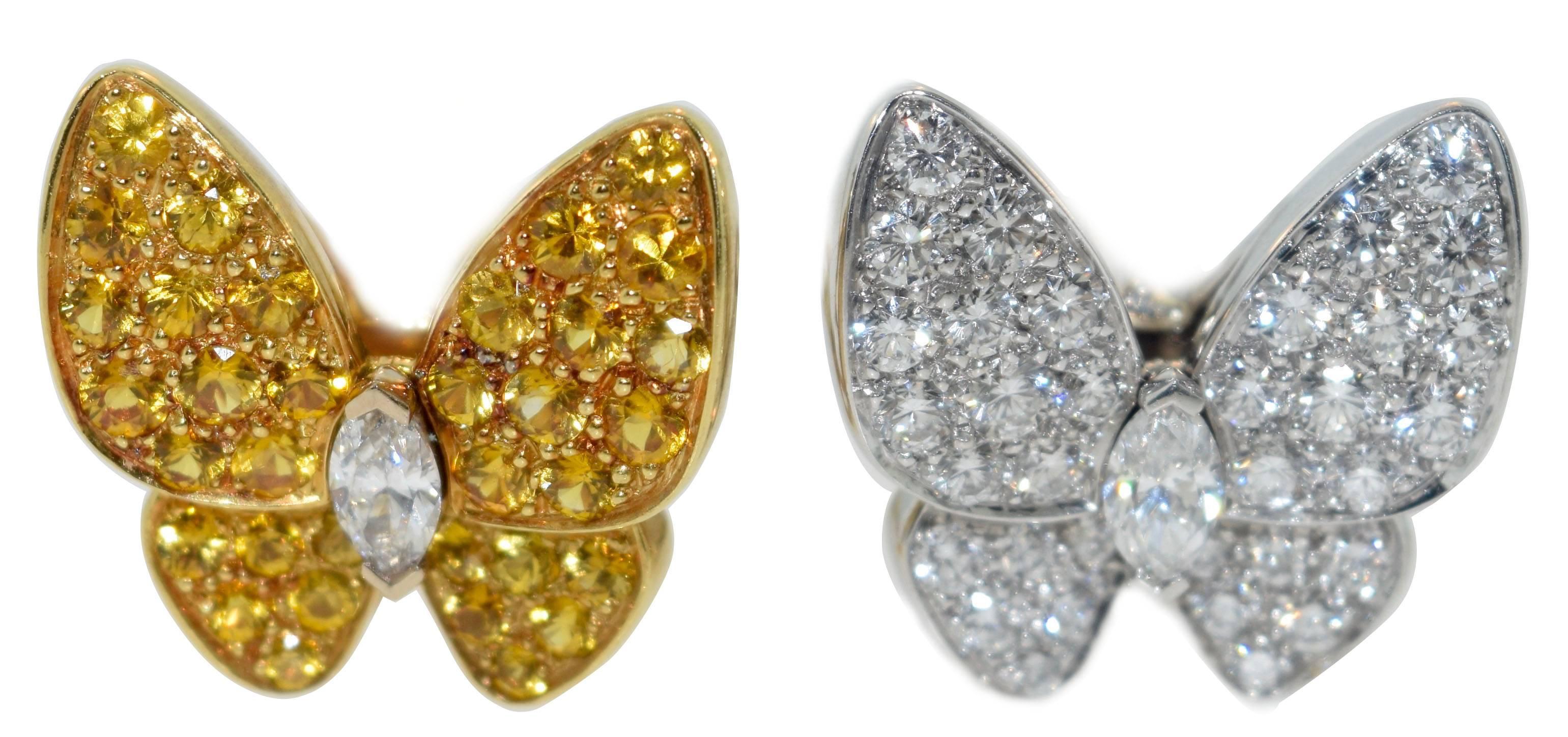About the Item:
Two butterfly earrings, one butterfly motif in pavé round diamonds with a marquise-shaped diamond center and the other in pavé round yellow sapphires with a marquise-shaped diamond center, the diamonds weighing approximately 0.99