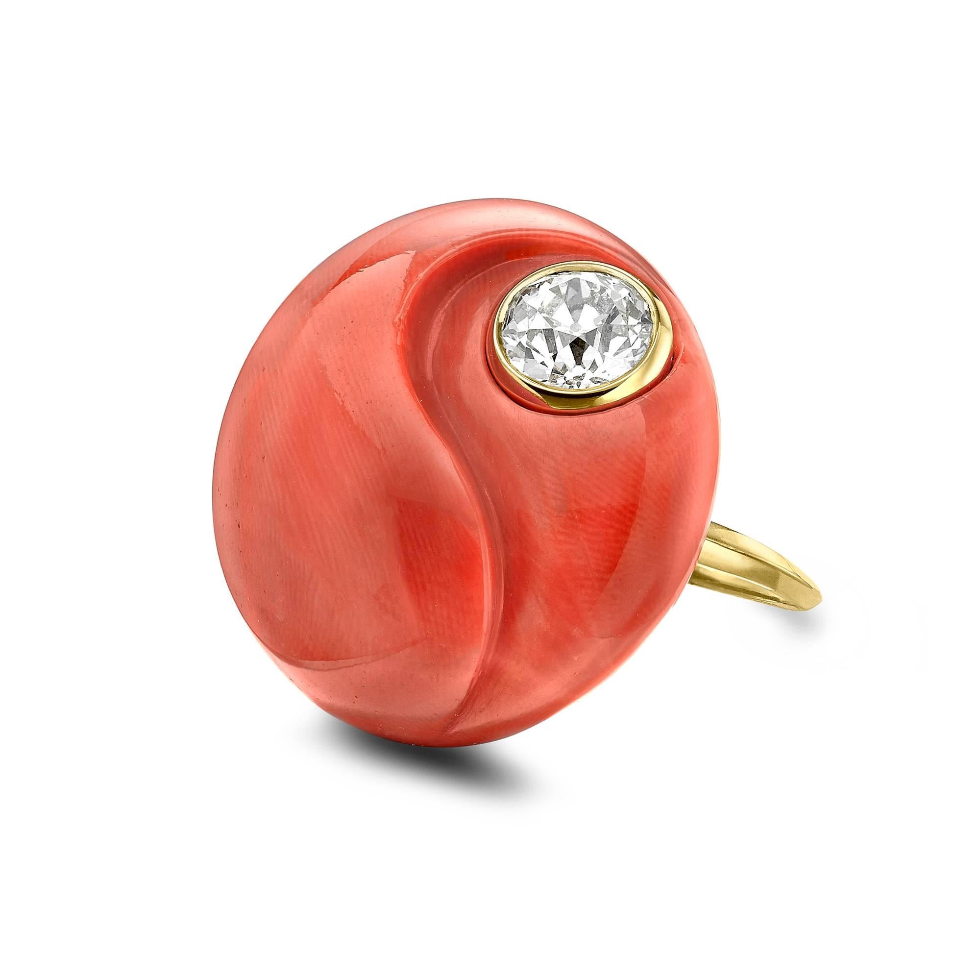 Unique Philip Sterle carved coral ring featuring an old cut diamond. An exceptional handcrafted piece of Coral has been carved into the Yin and Yang symbol  set within the coral is an old cut diamond in a yellow gold rubover setting. This exquisite