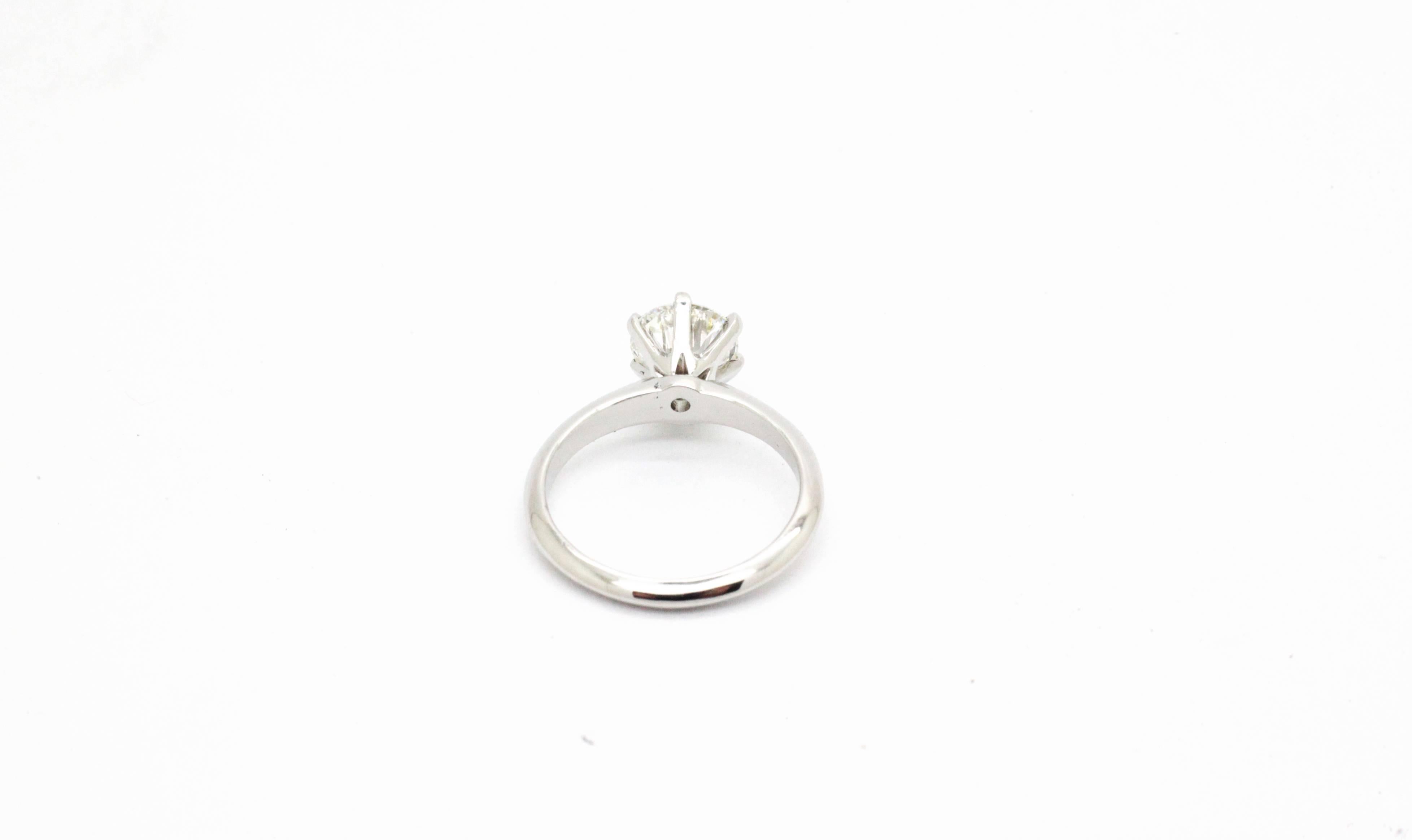 Perfectly hand crafted Platinum solitaire engagement ring by FERRUCCI, 
with six 