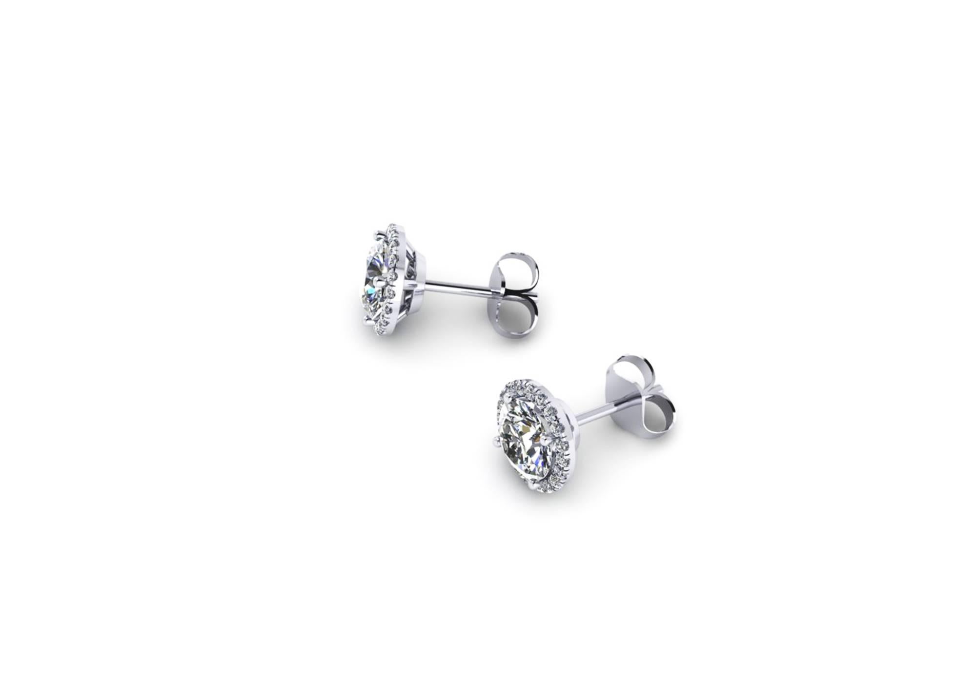 Ferrucci GIA Certified 2.15 Carat Diamond Halo Studs earrings hand made in Platinum in New York City by Italian master jeweler Francesco Ferrucci,
two gorgeous diamonds, G color, IF internally flawless of 1.06 carat and 1.05 carat, GIA Certificate