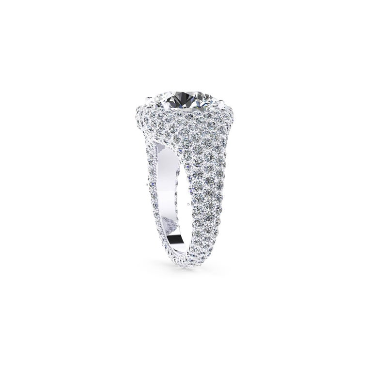 Ferrucci GIA Certfied 5.02 Carats, Round Cut, E Color VVS2 Clarity. 
Concieved by Ferrucci in New York City, hand crafted in his exclusive private Athelier in Manhattan, where the magic of jewelery happens. This gorgeous diamond ring is completely