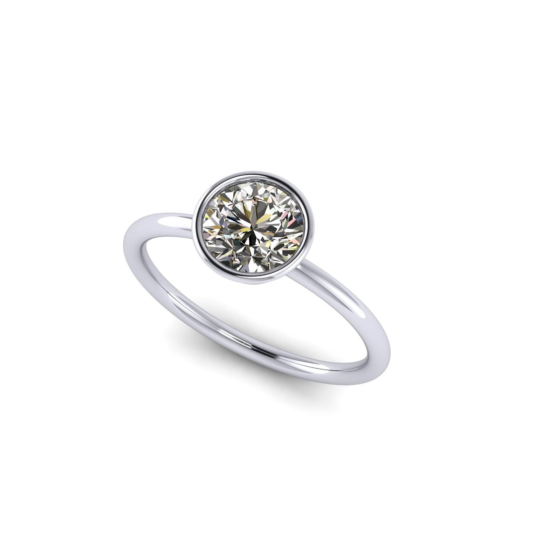 GIA Certified 1.01 Carat white diamond, color J, SI2 clarity, original GIA Certificate will accompany the ring.
Set in hand made Platinum 950, low setting bezel ring, with round wire shank,  made in New York City, 

Ring size 5 3/4, complimentary