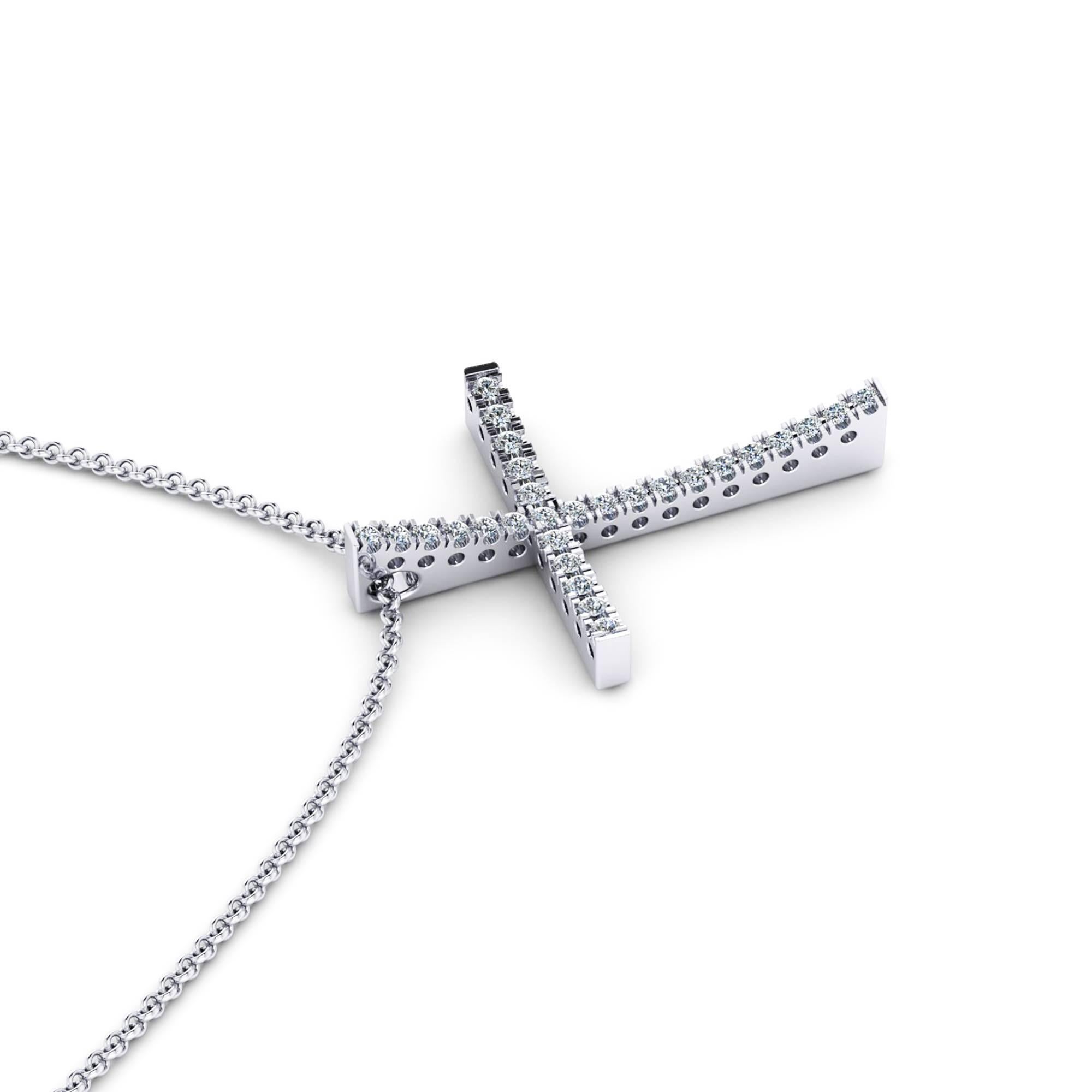 from Ferrucci a 0.28 carat white round diamond cross, conveiced in 18k white gold with a 18k white gold link necklace 20 inches long with the possibility to close it at 18 inches length.

The cross is slightly above 1 inch in lenght and 0.7 inch in