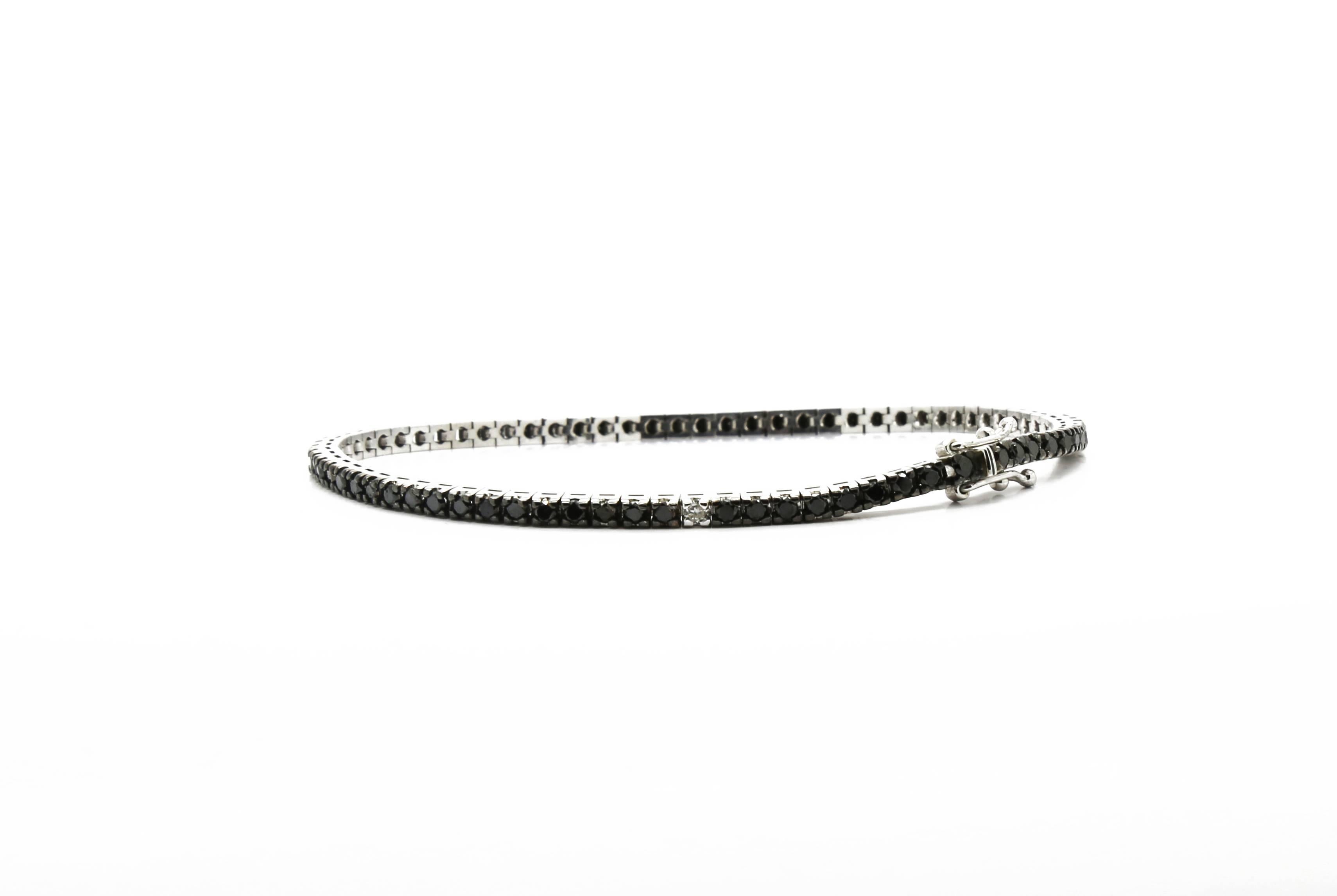 Tennis Black Diamonds bracelet with one white diamond by FERRUCCI elegant and sophisticated, yet redesign for an edgy modern look, Made in Italy 

Black Diamonds total carat weight 2.70 ct

White Diamond carat weight 0.04 ct