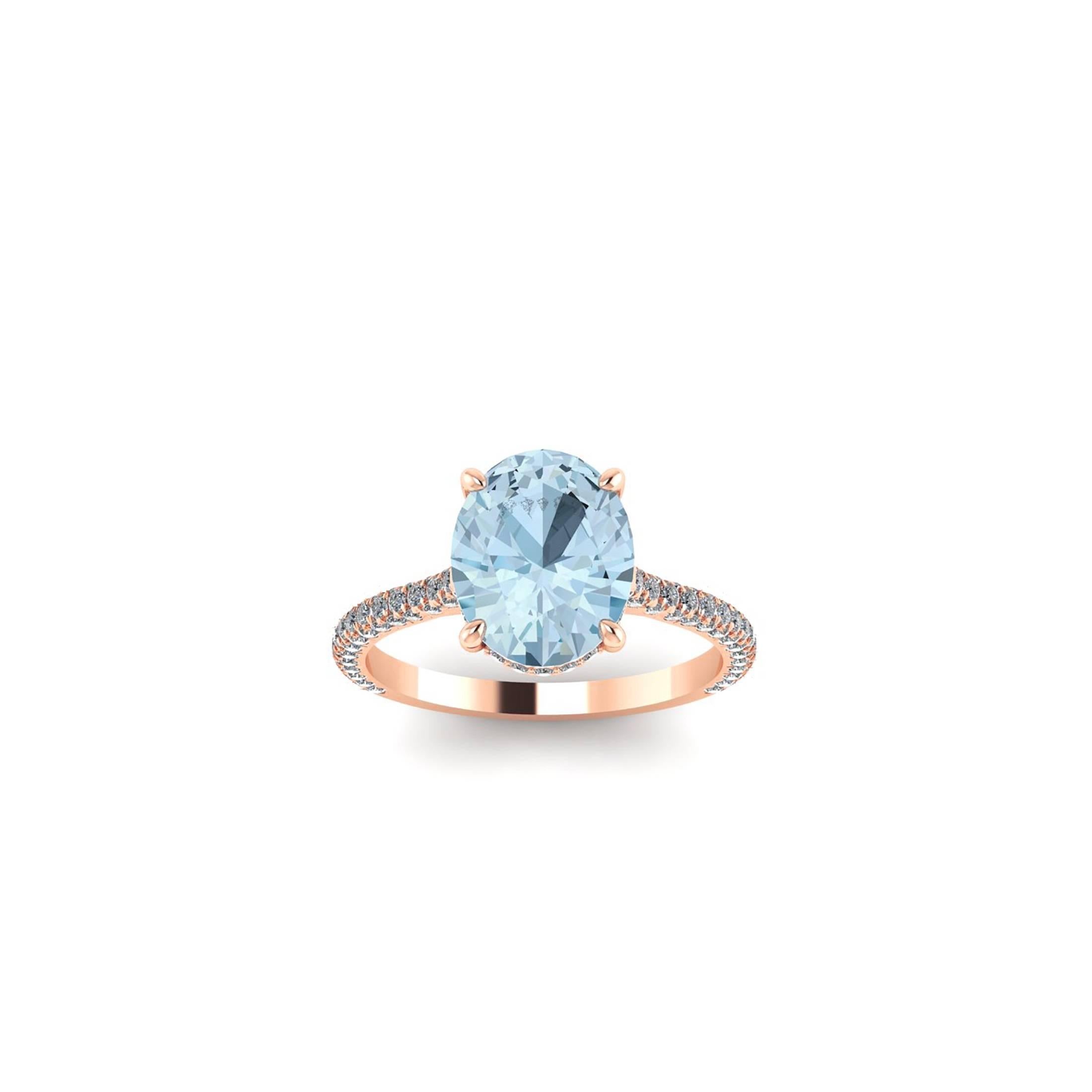 2.22 Karat blauer Aquamarin, handgeschliffen, gefasst in einem Ring aus 18 Karat Roségold, 
geschmückt mit weißen, runden, handgefassten Diamanten (ca. 0,50 Karat), die für ein Maximum an Glanz und Funkeln sorgen.

Dieser Ring hat die Größe 6  3/4