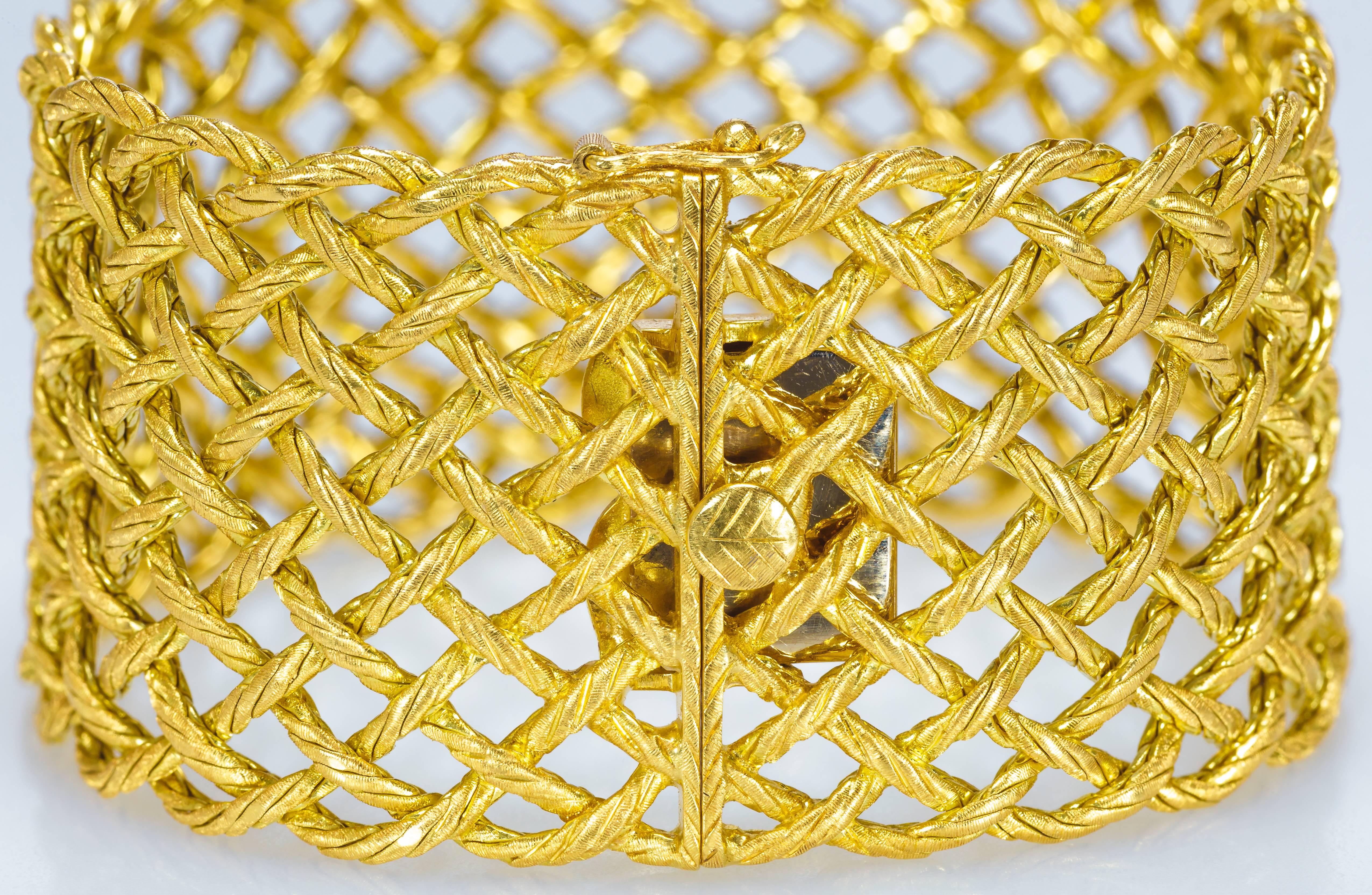 This Buccellati Crepe de Chine bracelet features 12 18K yellow gold interwoven chains.  It has a push-button release with a safety clasp.  The bracelet measures 7 3/8
