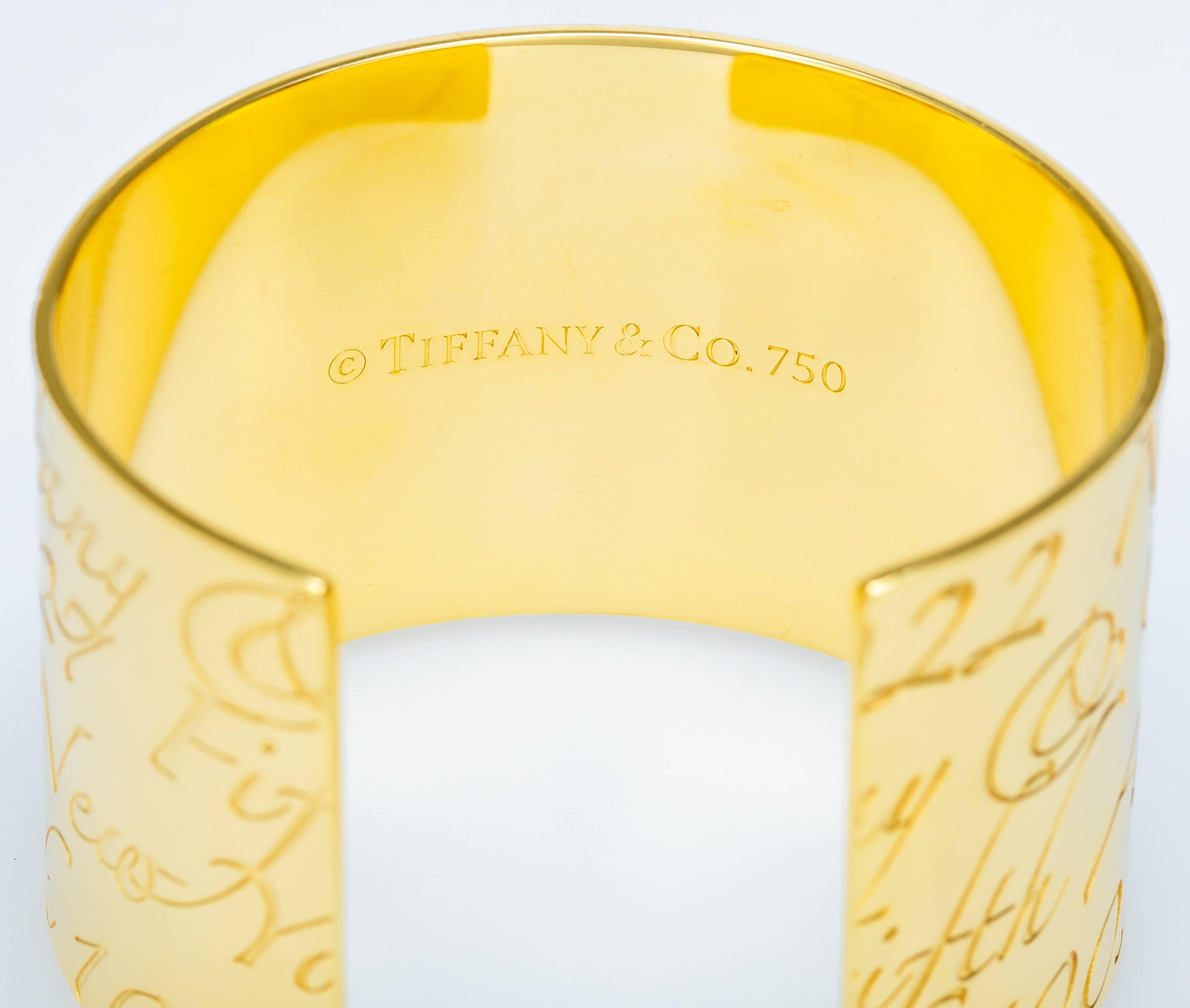 This 18K yellow gold Tiffany & Co. cuff from the Notes collection is features the address of the flagship Tiffany store in New York.  The bracelet measures ~5.5 inches long (~6.5 including the gap) and ~1.5 inches wide.  It has been lightly polished