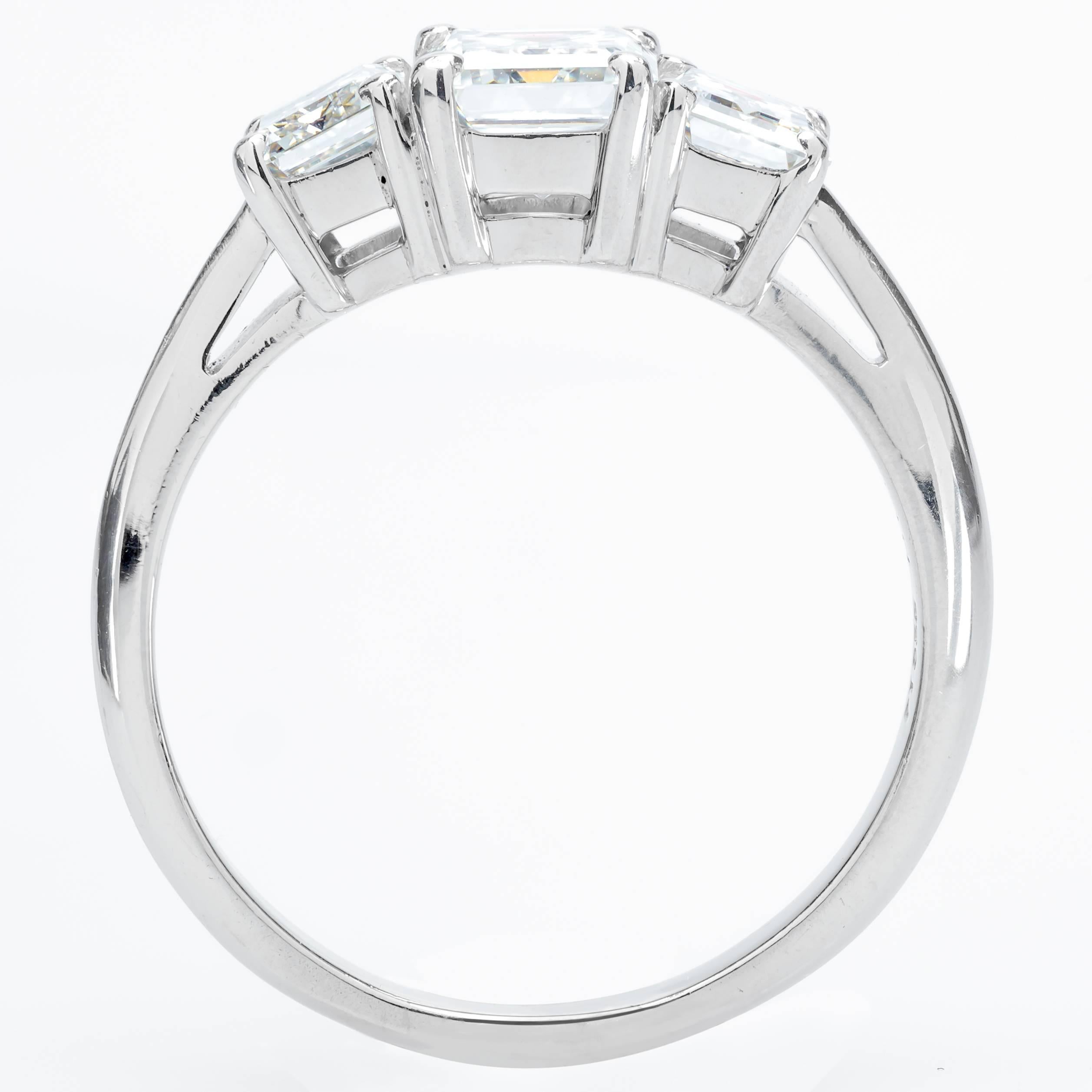 This platinum size 6 Tiffany & Co. ring has 3 emerald cut diamonds.  The diamonds measure the following:
- Center: 1.01ct G/VVS2 6.46mm x 5.15mm x 3.53mm
- Side: 0.51ct G/VVS2 5.35mm x 3.96mm x 2.70mm
- Side: 0.55ct G/VVS2 5.39mm x 4.02mm x