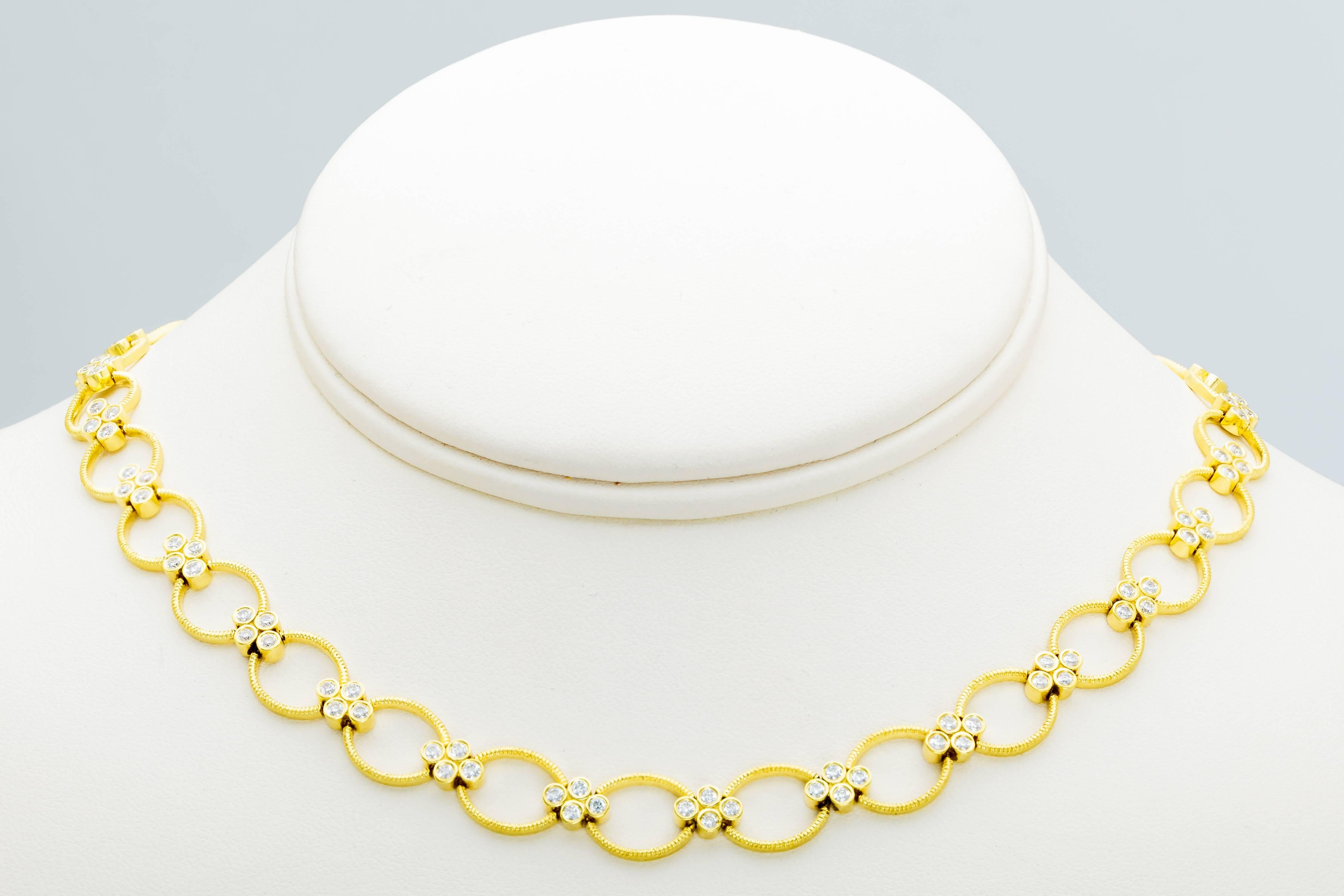 This 18K yellow gold Leslie Greene necklace is set with 80 diamonds totaling 1.60ct.  It has a brushed finish on the sides and back.  The necklace measures 15