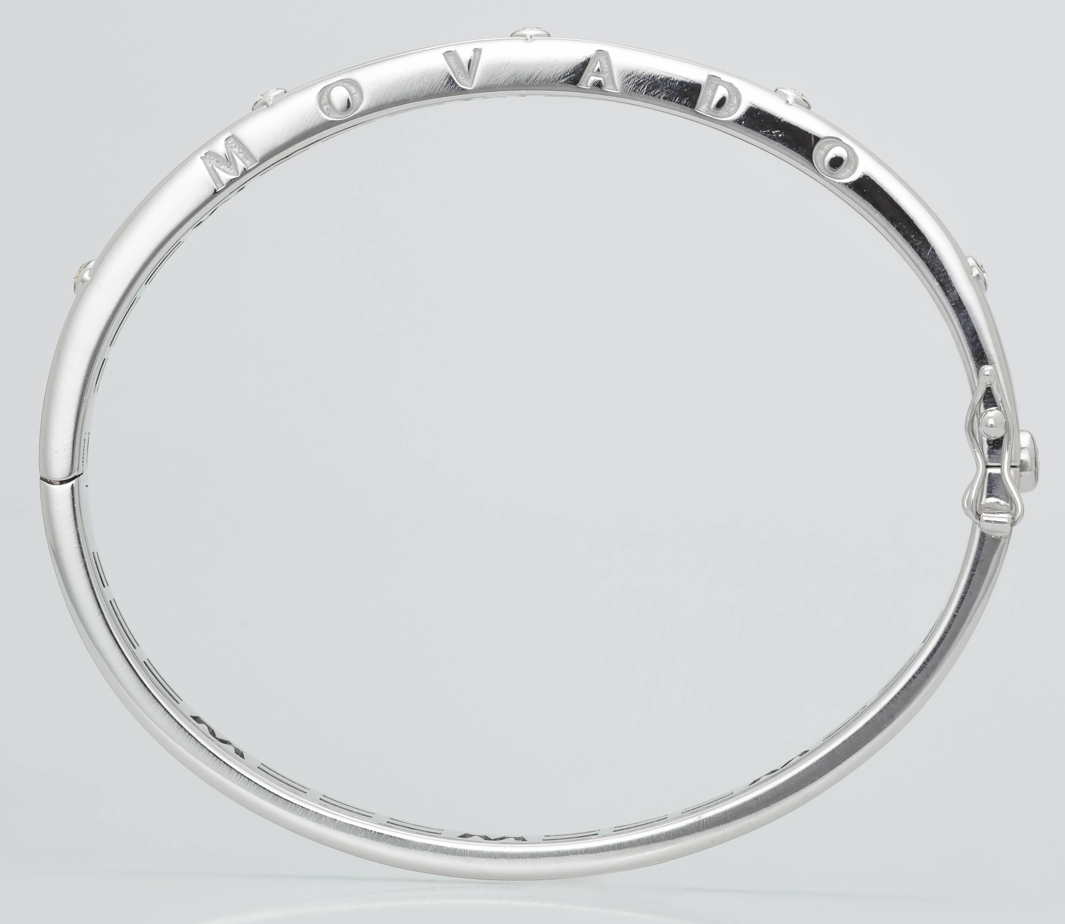 This 18K white gold Mavado bracelet is set with 5 diamonds totaling 0.15ct.  It is stamped on the side with 