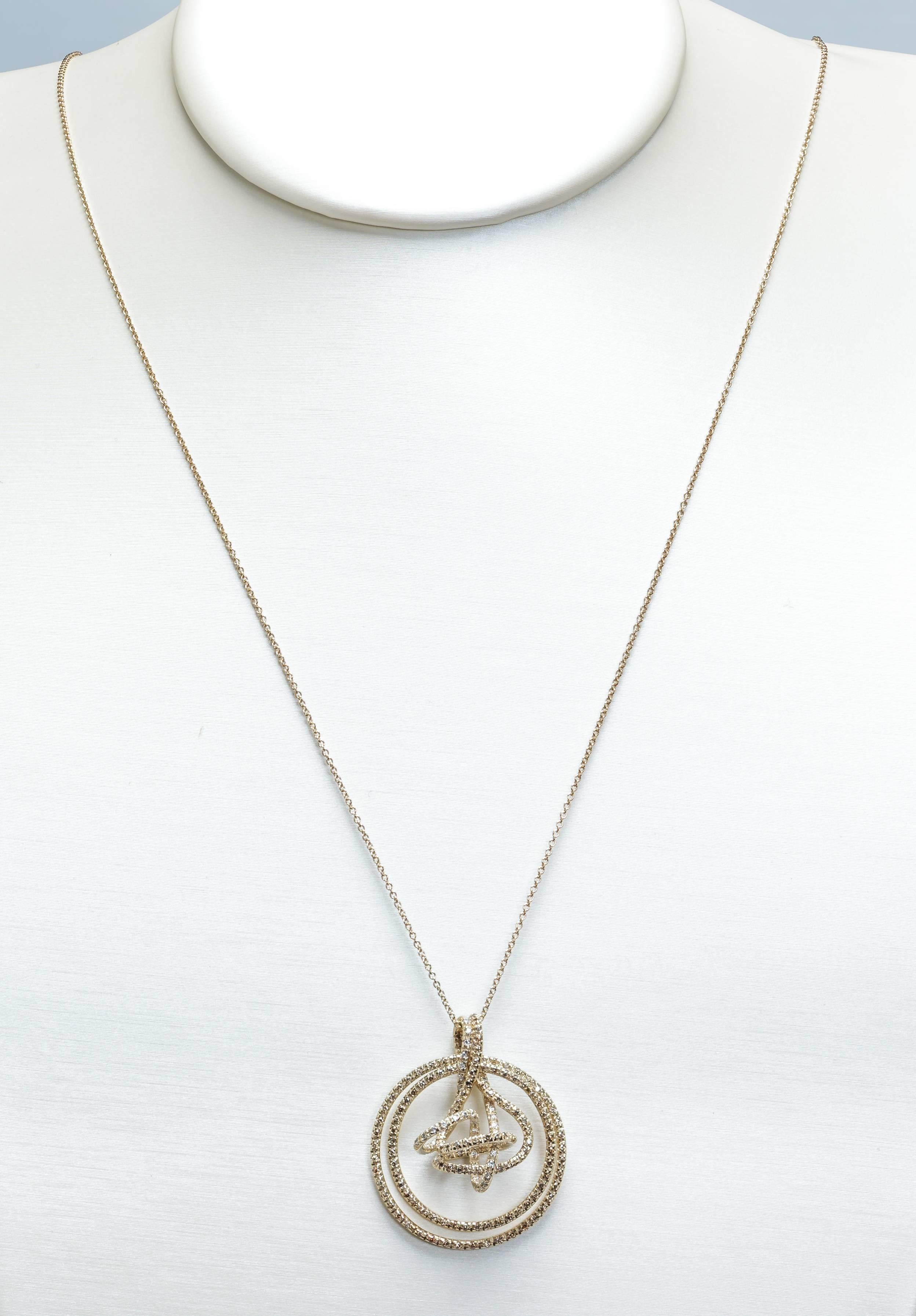 This new H. Stern necklace features a zephyr pendant set with both cognac and colorless diamonds totaling 1.01ct in 18k noble gold on a 30" 18k noble gold chain.  Noble gold is H. Stern's alloy that is between a yellow and white gold.  The