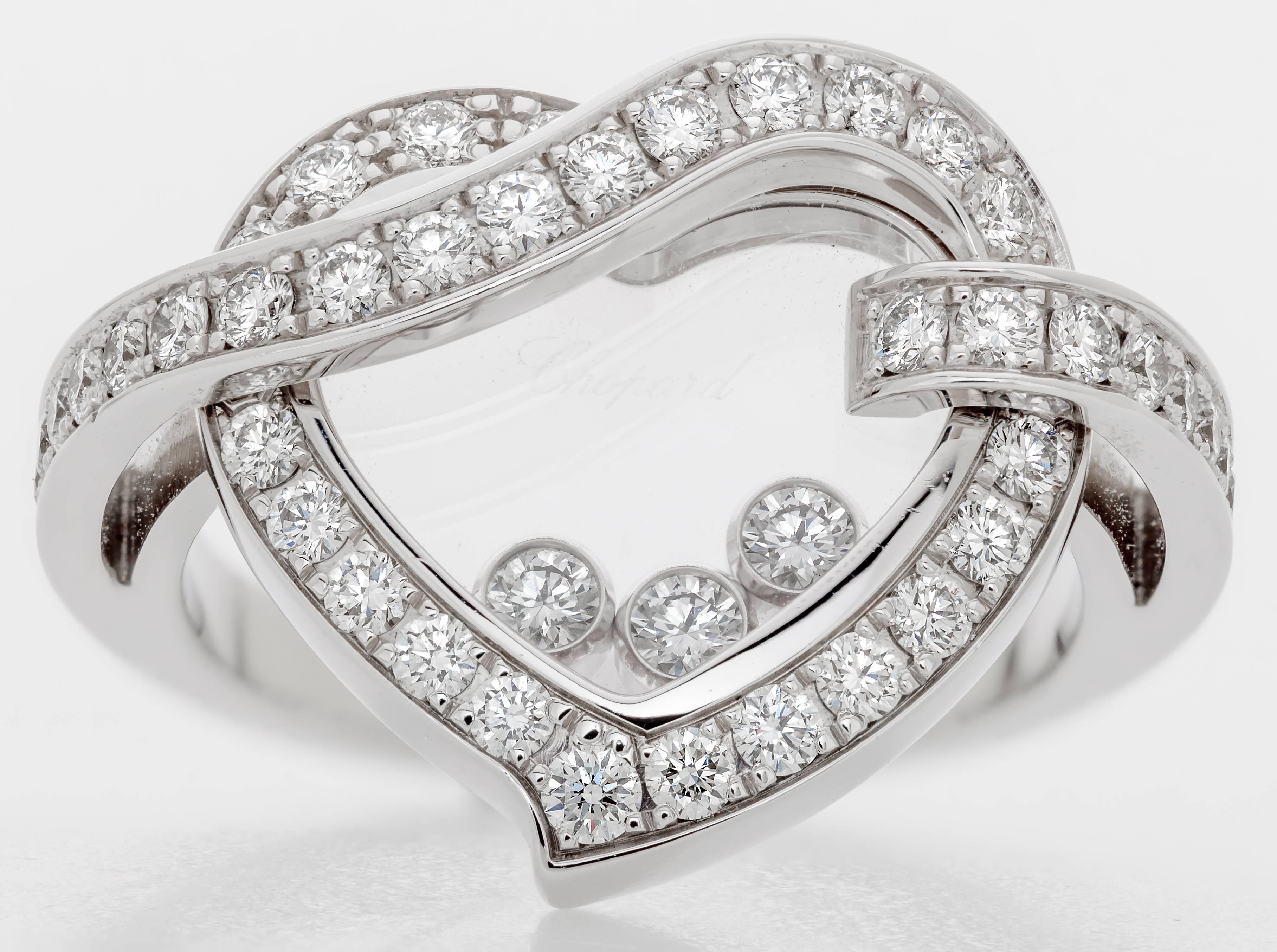 This new Chopard Happy Heart diamond ring features three floating diamonds surrounded by a heart design.  The heart contains 42 diamonds totaling 0.75ct and the 3 floating diamonds total 0.17ct.  The ring is a size 6.5 and measures 2.6cm tall, 2.3cm