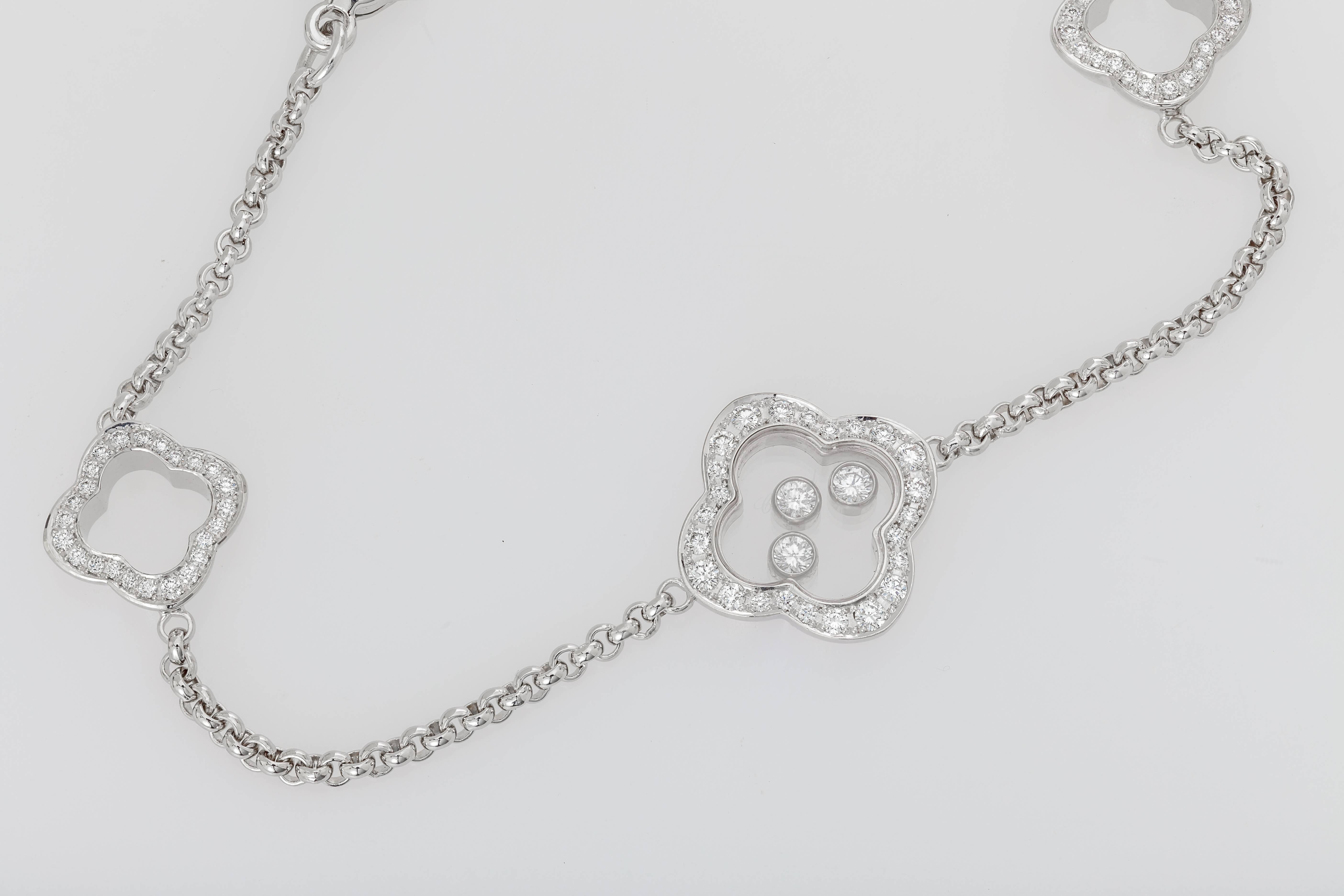 This new Chopard bracelet from the Happy Diamonds collection features three floating diamonds.  The diamonds on the clovers total 0.44 ct. and the three floating diamonds total 0.17 ct.  The bracelet is made of 18k white gold. It has multiple points