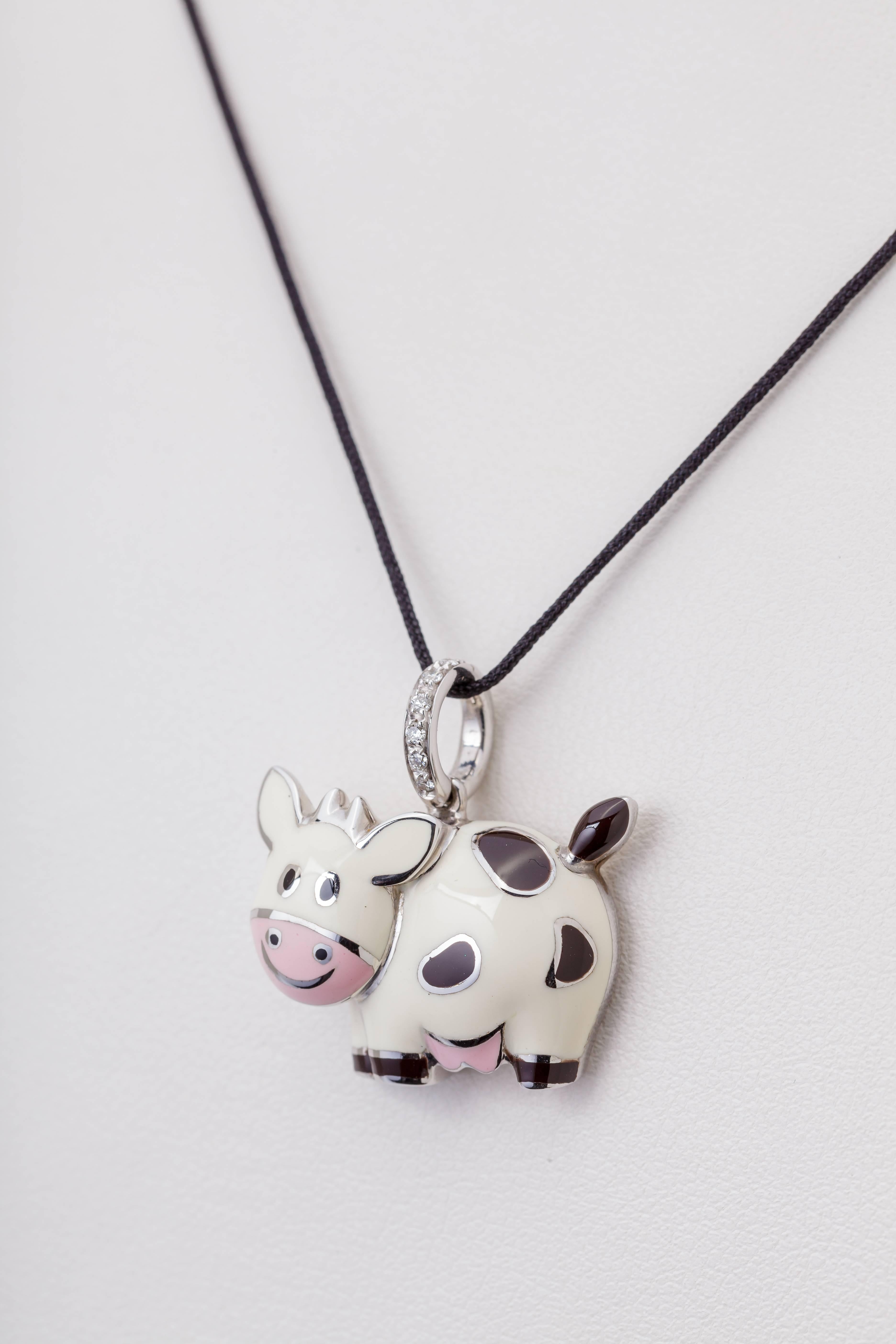 This Aaron Basha cow dangle charm is 18k white gold with enamel.  The bail is set with diamonds totaling 0.06ct.