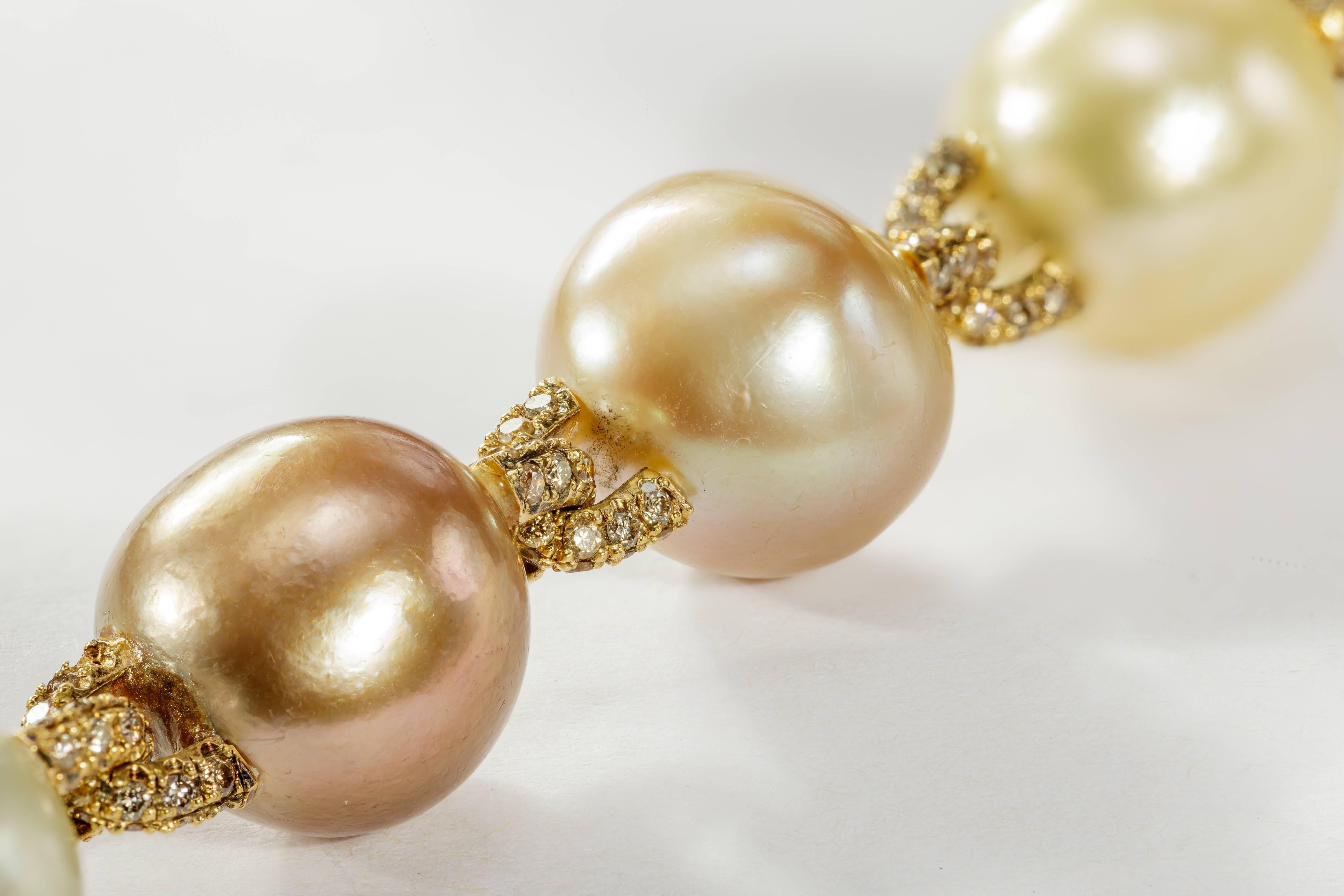 This Yvel bracelet features 10 multicolored baroque pearls linked by 18k yellow gold.  The yellow gold links are set with diamonds totaling 3.24ct.  It measures 8 inches long.