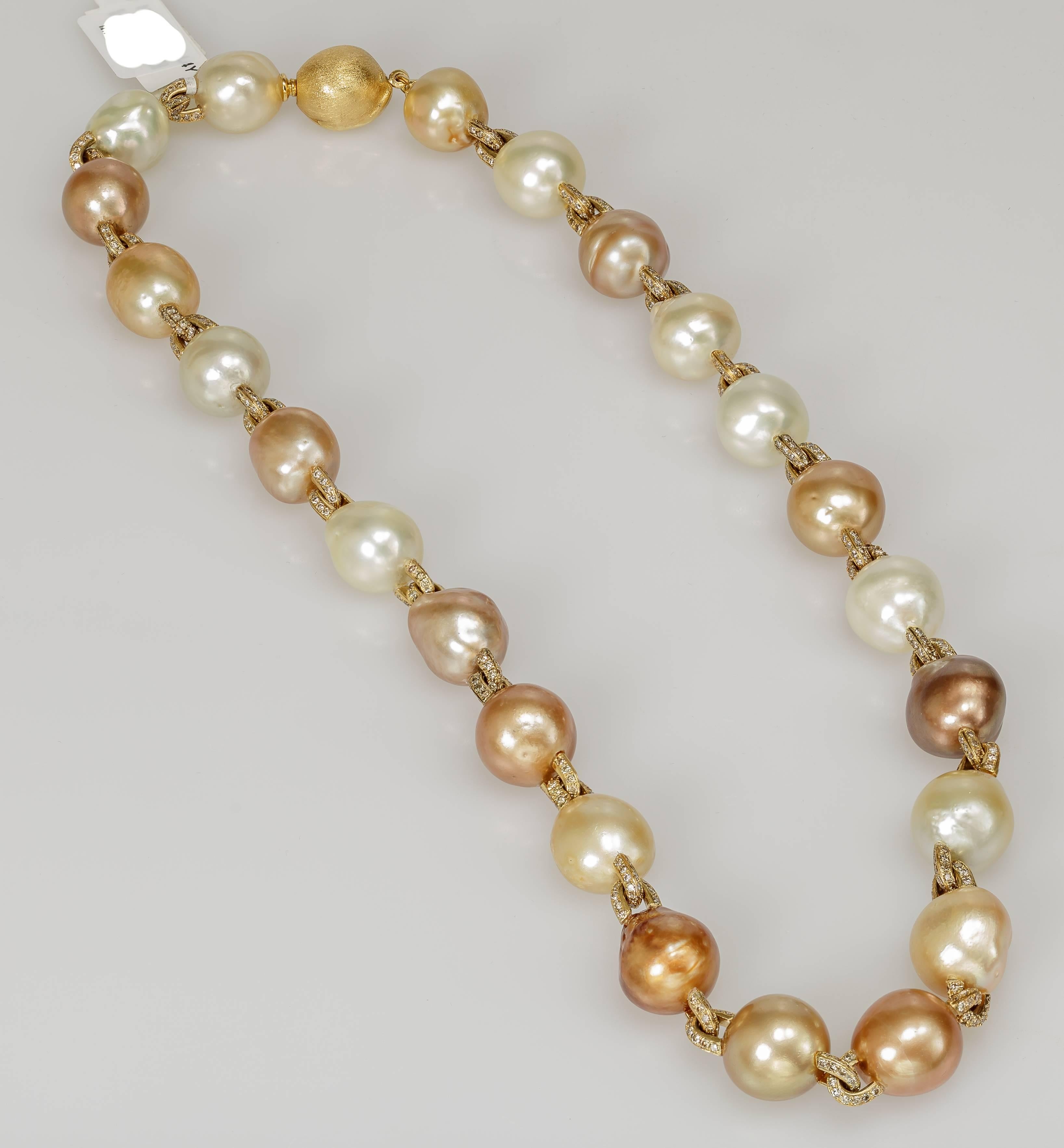 This Yvel necklace features baroque pearls linked with 18k yellow gold to make an 18 inch long strand. The links are set with diamonds totaling 4.14 ct.